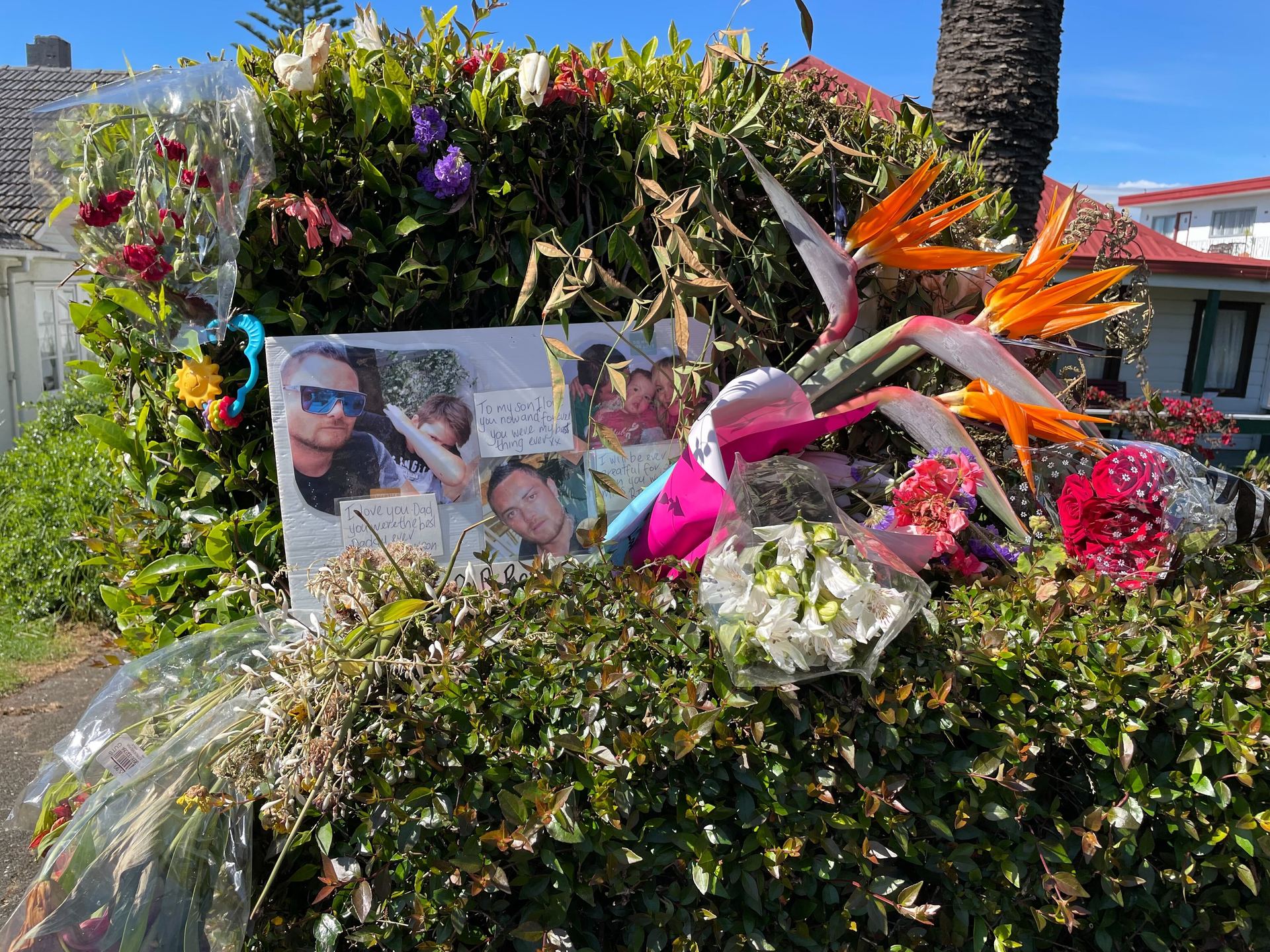Flowers and tributes have been left near the driveway where Robert James Hart died on Friday. Photo / NZME