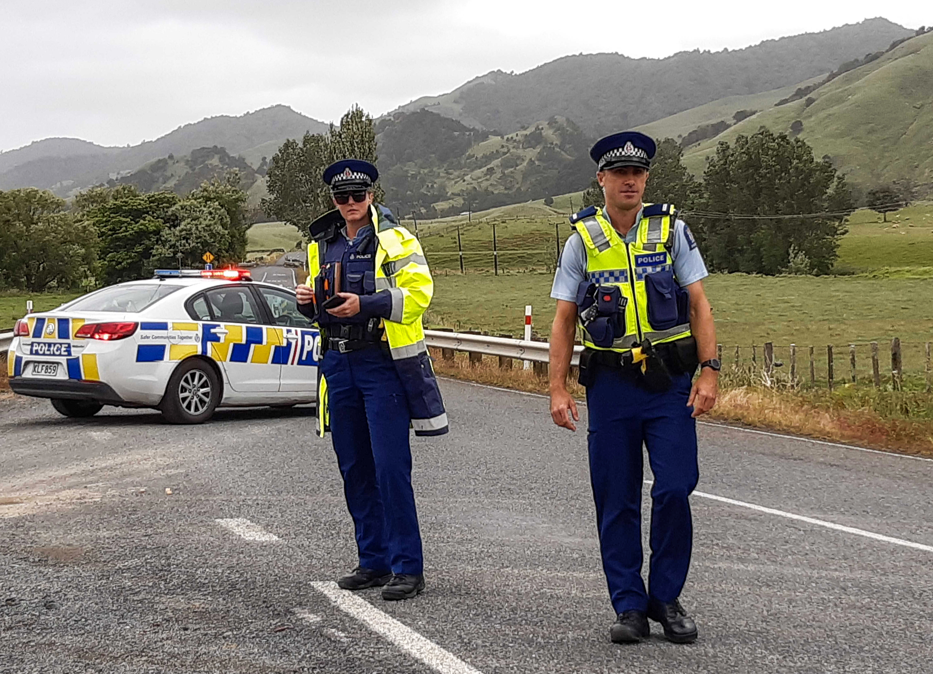 Police at a check point on State Highway 14 after a man shot at police, seriously injuring a police dog, near Tangowahine last December.