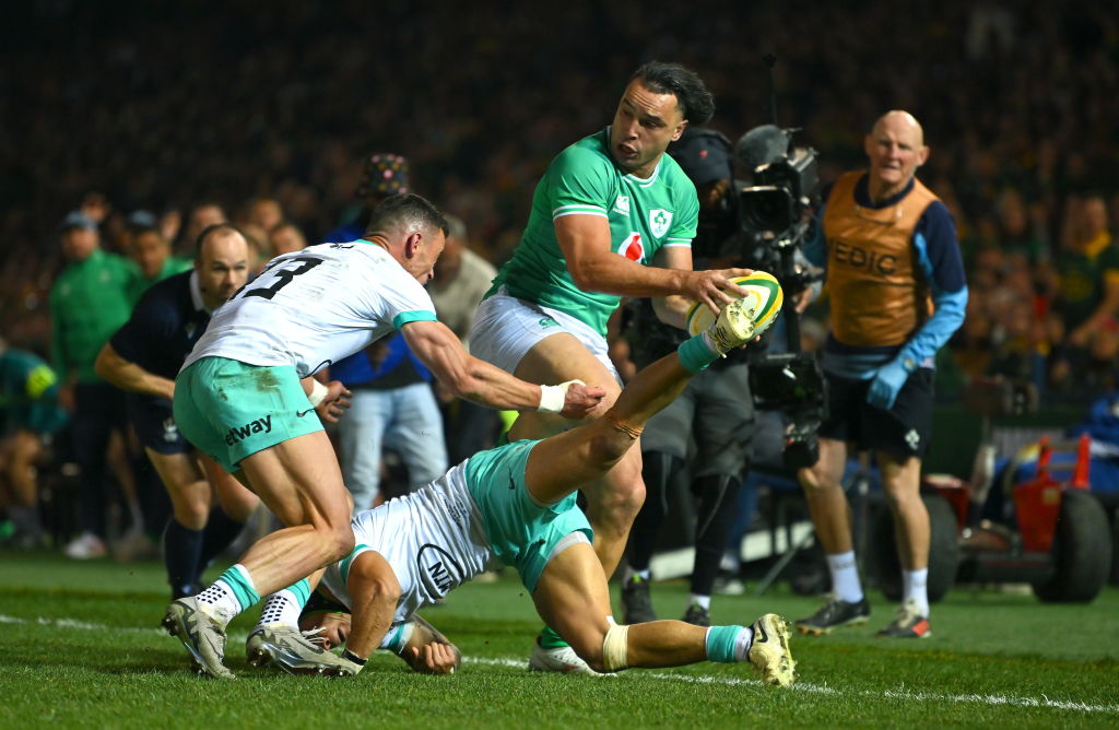James Lowe of Ireland beats the tackles of and Jesse Kriel and Cheslin Kolbe of South Africa. Photo / Getty Images