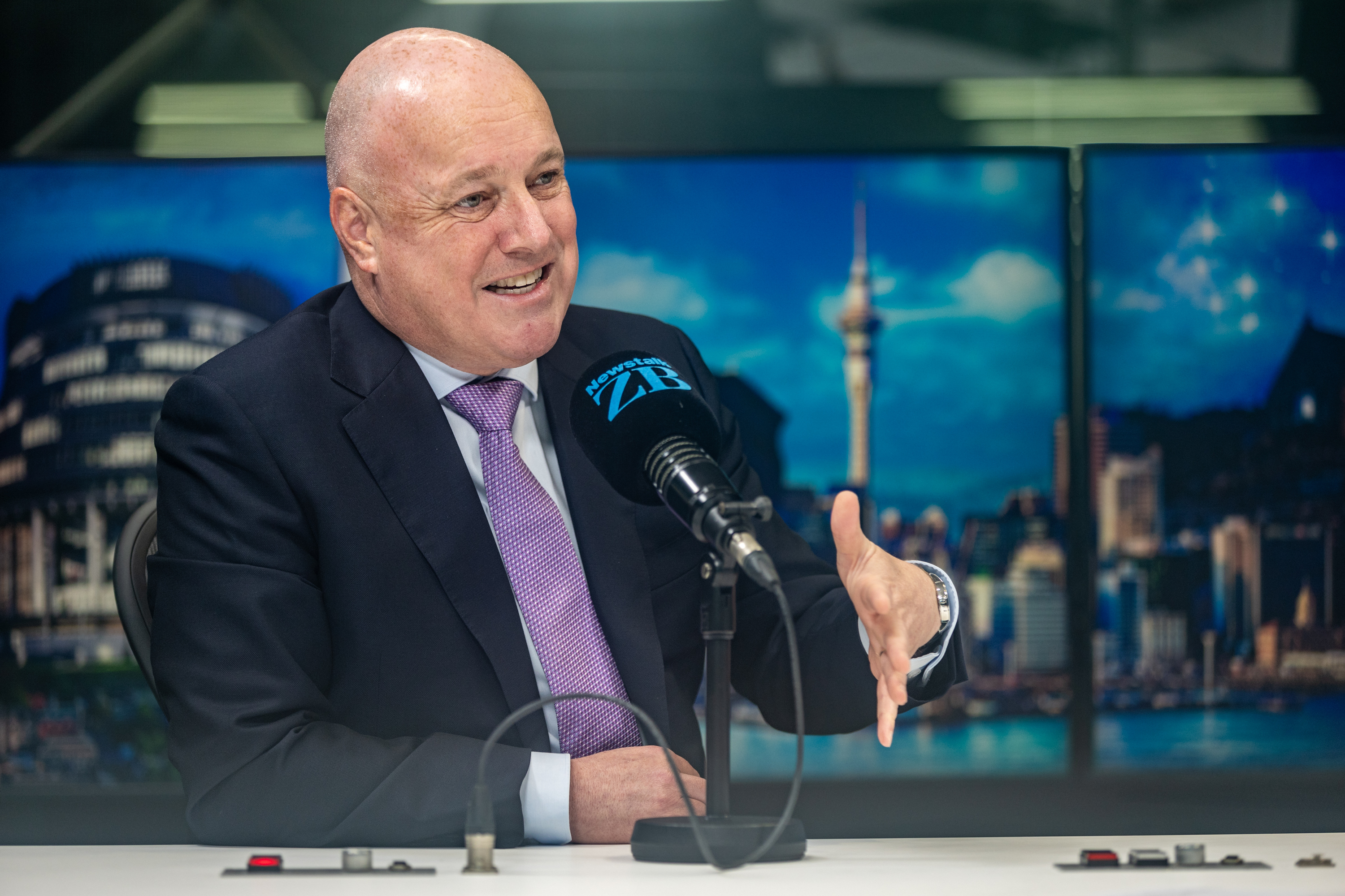 Prime Minister Christopher Luxon speaking in the Newstalk ZB studio this morning. Photo / Michael Craig
