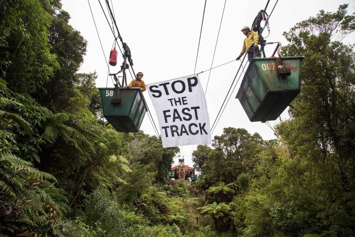 Protesters from 350 Aotearoa in the coal buckets at the Stockton Mine on the Denniston Plateau, where they spent two nights last week.