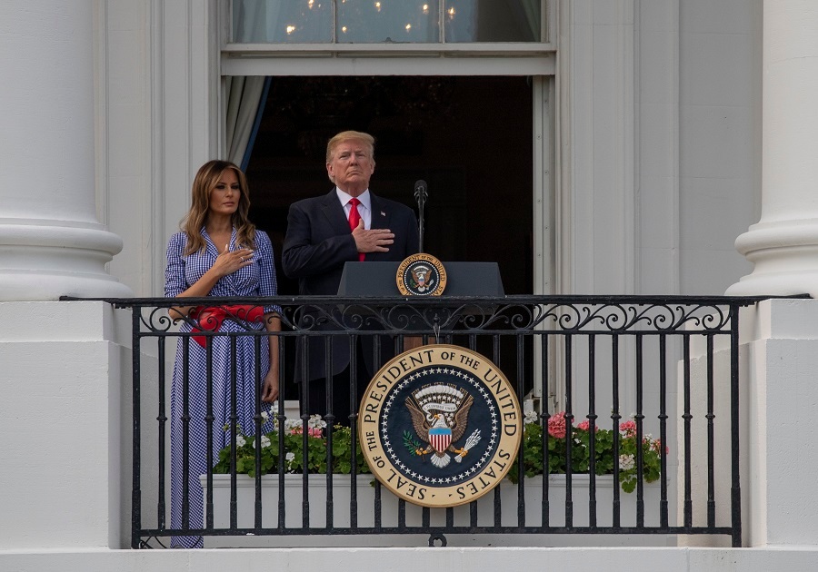 US President Donald Trump and first lady Melania Trump stand for the National Anthem during a picnic for military families on the South Lawn of the White House. Photo / Getty Images