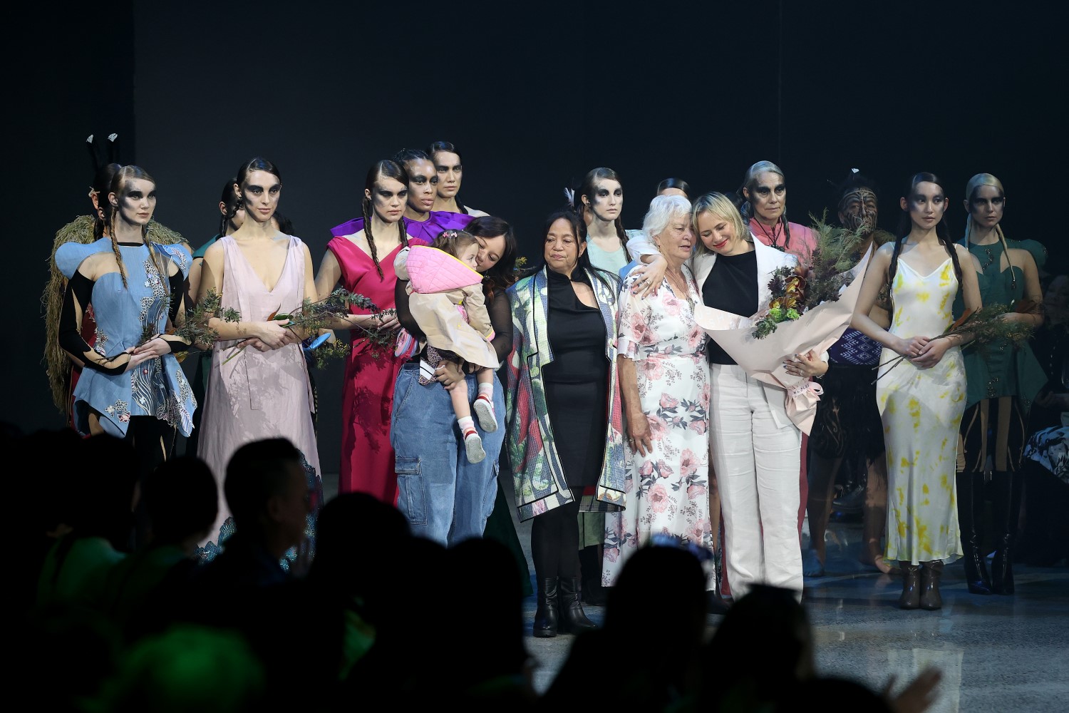 Tessa Lont with her designs and family on the runway at New Zealand Fashion Week: Kahuria 2023. Photo / Getty Images