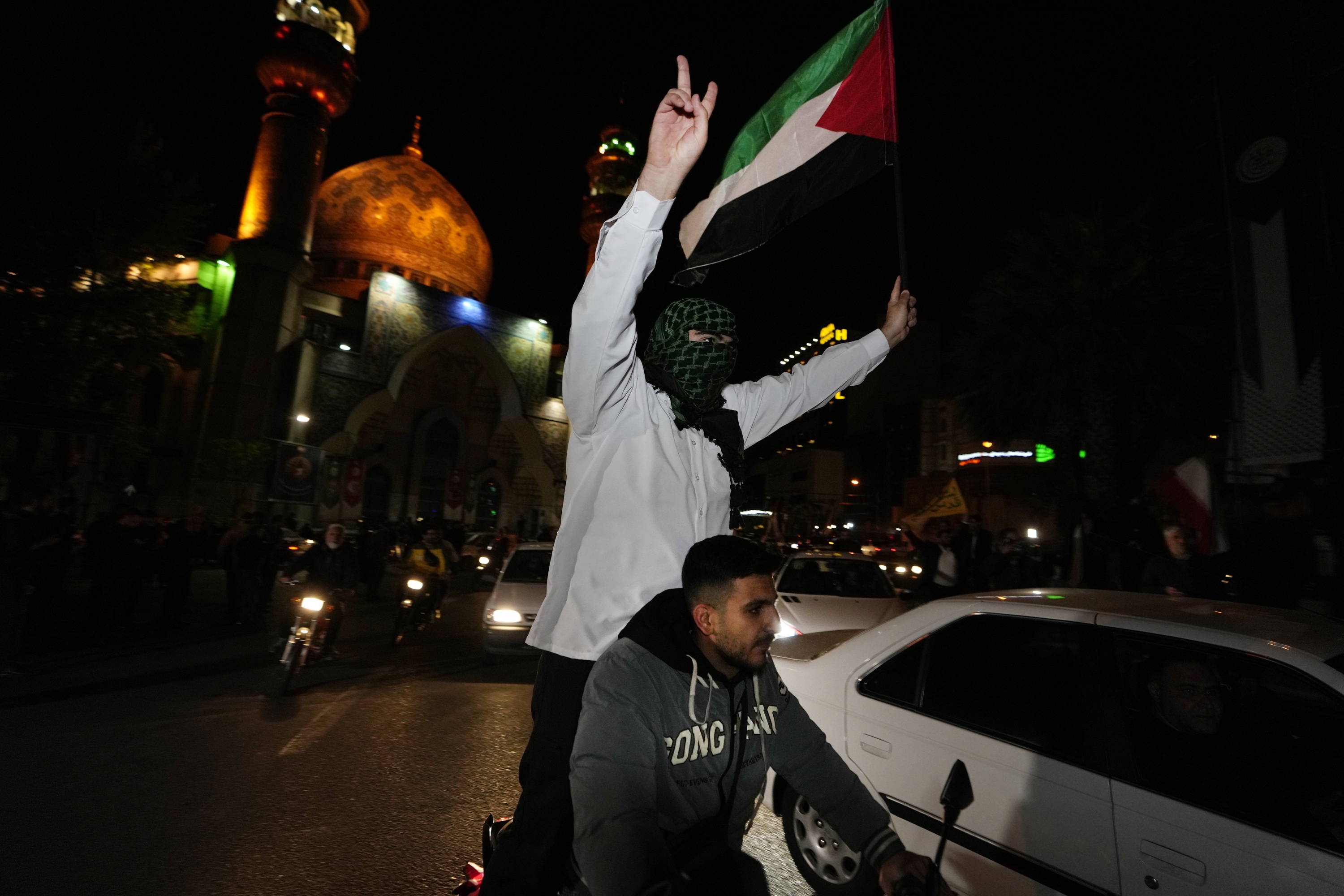 Iranian demonstrators wave a Palestinian flag during their anti-Israeli gathering in Tehran, Iran, earlier today. Photo / AP