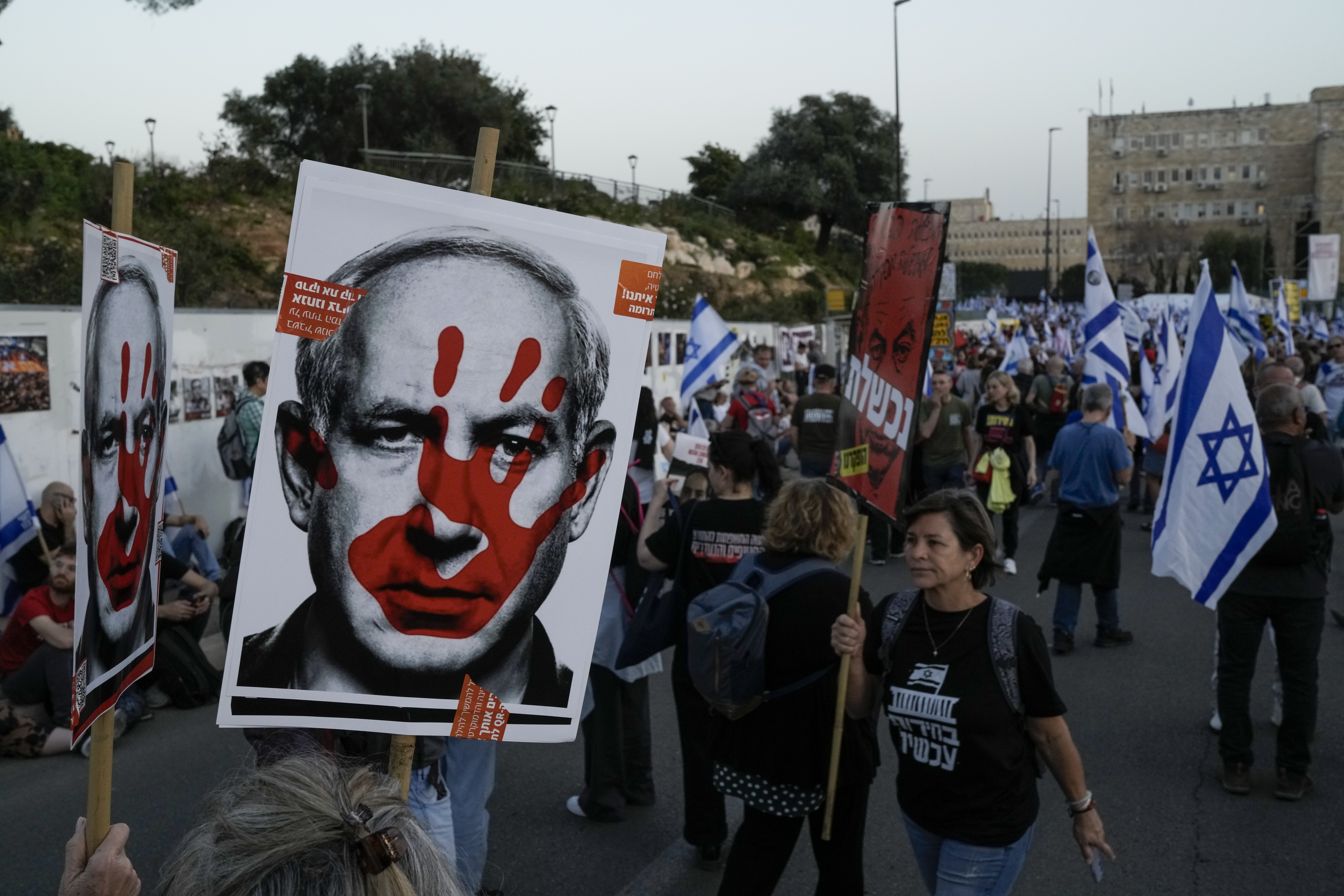 People take part in a protest against Israeli Prime Minister Benjamin Netanyahu's government and call for the release of hostages held in the Gaza Strip by the Hamas militant group outside of the Knesset, Israel's parliament, in Jerusalem on March 31. Photo / AP