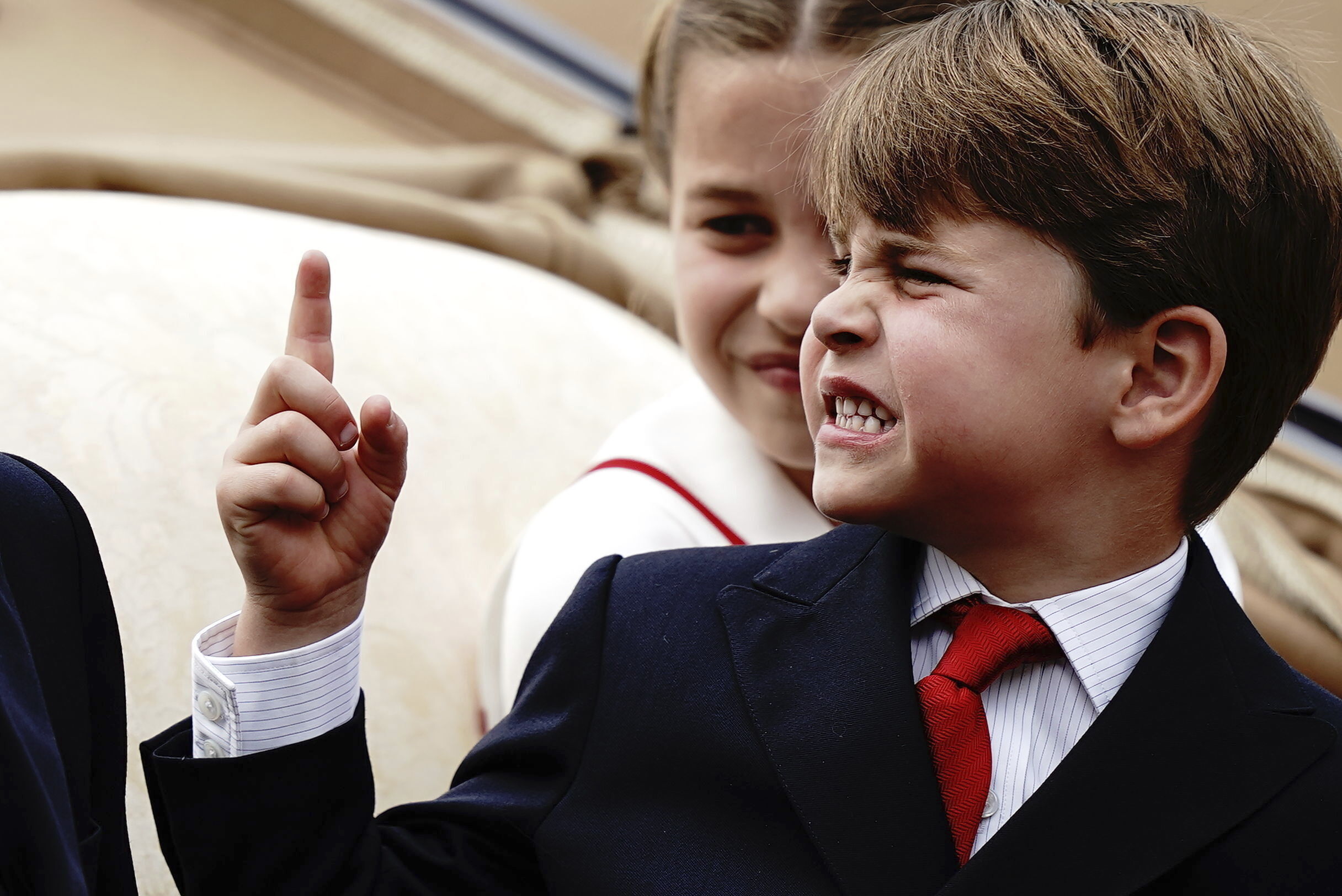 Prince Louis reacts to something while in a carriage with his siblings during the Trooping the Colour ceremony at Horse Guards parade in London. Photo / AP