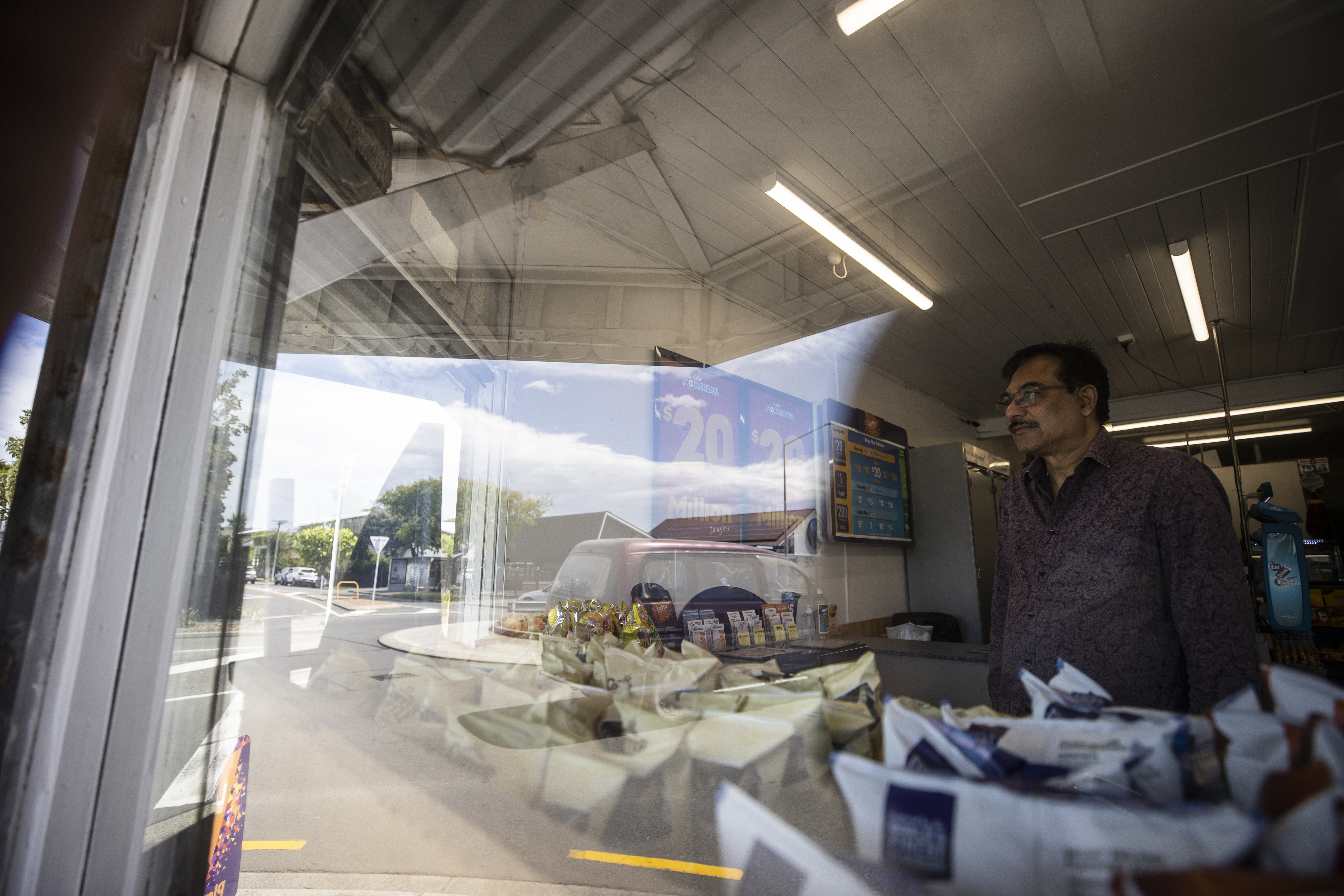 Mukesh Patel has owned his South Brighton dairy for 19 years and will speed the selling process up due to living in fear “twenty-four seven”. Photo / George Heard