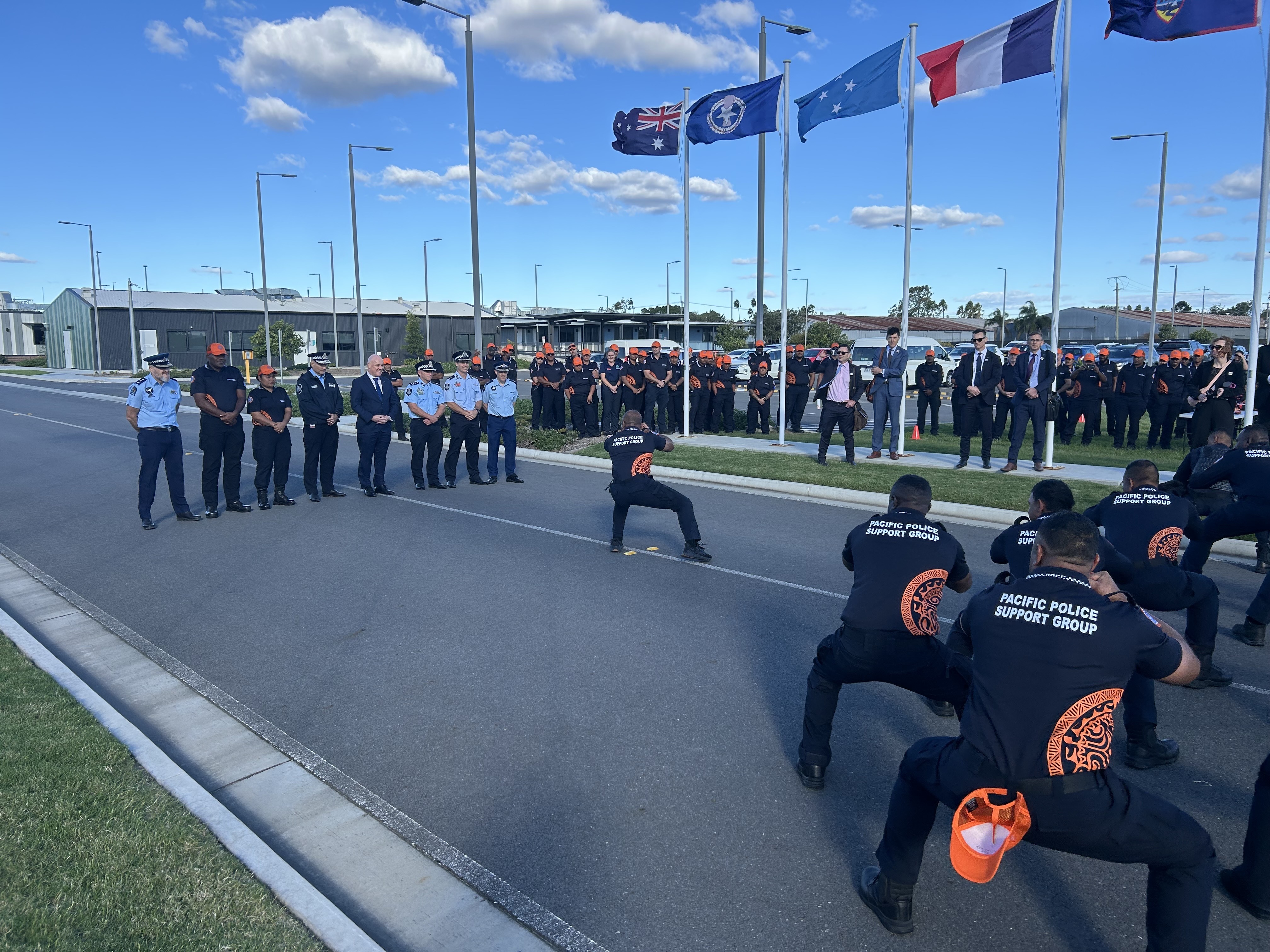 Prime Minister Christopher Luxon is greeted with a cultural performance at a Pacific Policing base in Brisbane. Photo / Adam Pearse
