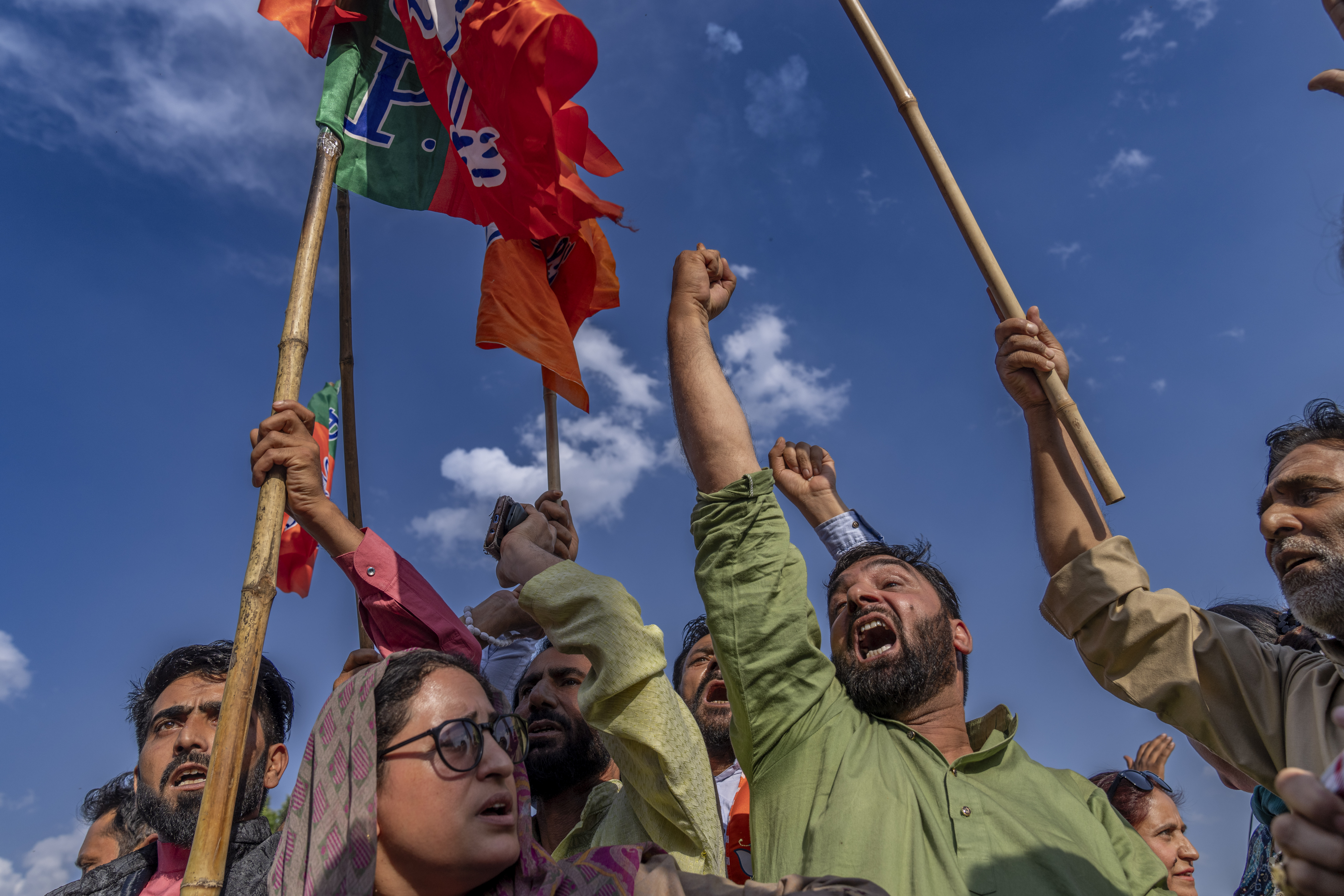 Bharatiya Janata Party (BJP) supporters shout slogans as they celebrate their party's lead during the counting of votes outside the party office in Srinagar, Indian-controlled Kashmir. Photo / AP