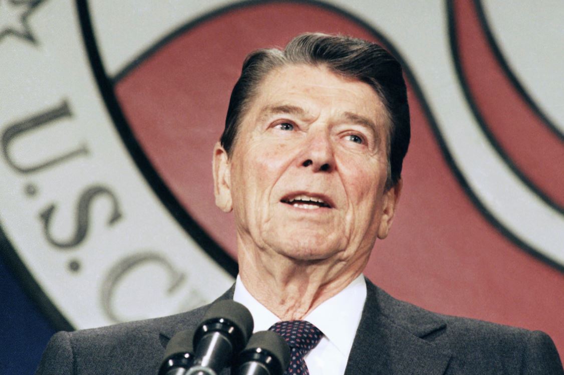 John Hutton, who served as physician to President Ronald Reagan, pictured in 1986, fought with White House officials in 1985 after they disregarded his warning that Reagan would be incoherent from anesthesia for hours after surgery and instead rushed to restore his powers. Photo / AP