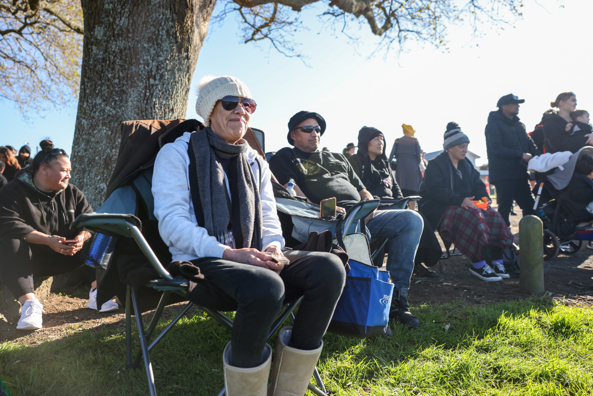 Rina Ngatai from Pukekohe was all set up on the banks of the Waikato river to watch waka carrying the King’ casket. Photo / Mike Scott