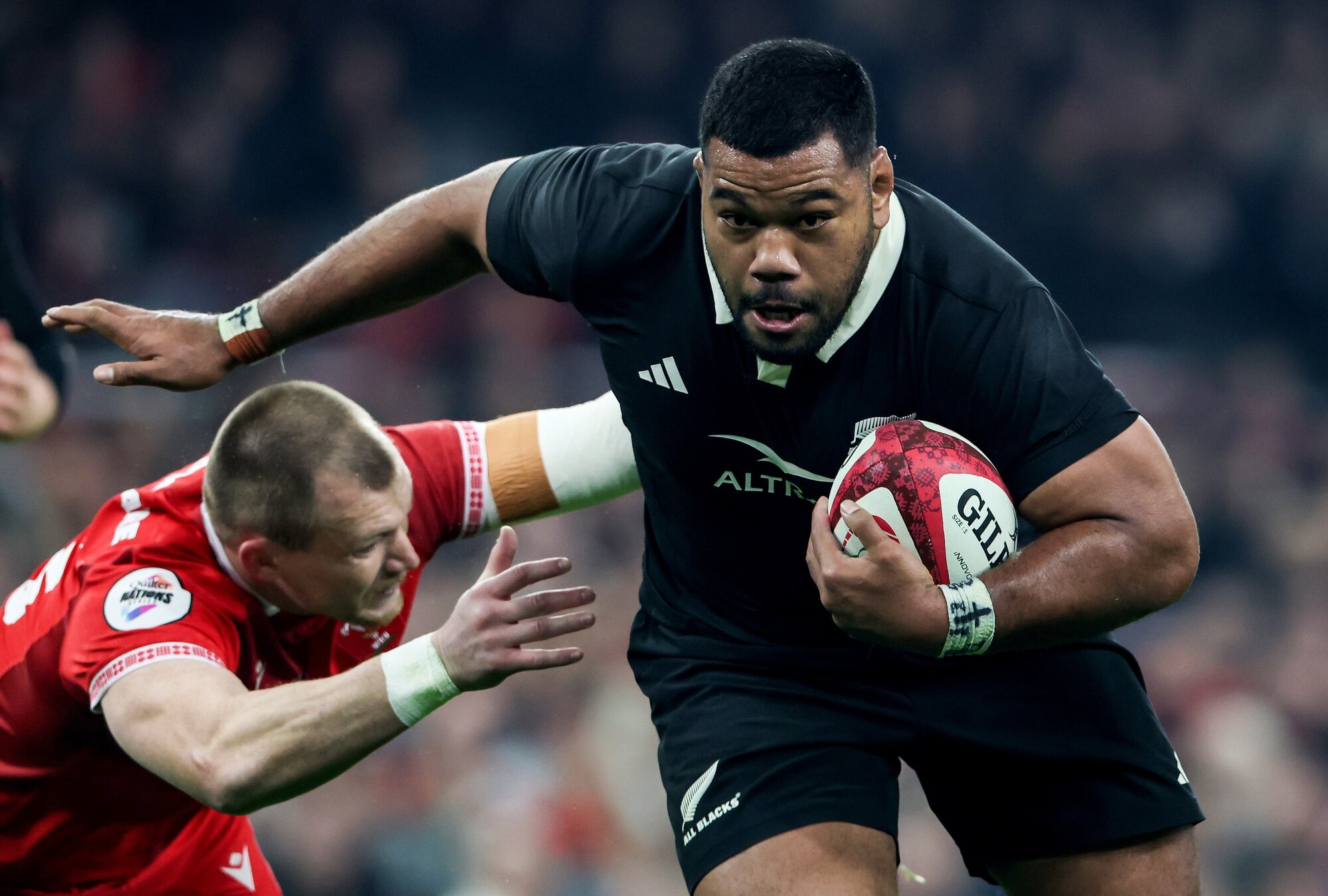 All Blacks hooker Samisoni Samisoni Taukei’aho heads for a gap against Wales, in Cardiff. Photo / Photosport