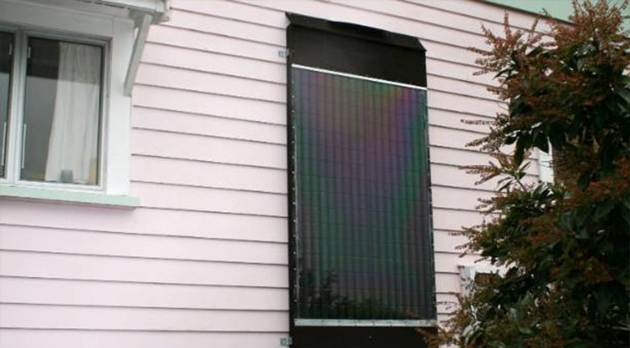 Two holes were cut at the top and bottom to allow airflow and the entire panel was fitted to the eastern side of the house for maximum sunlight. Photo / Frugal Kiwi