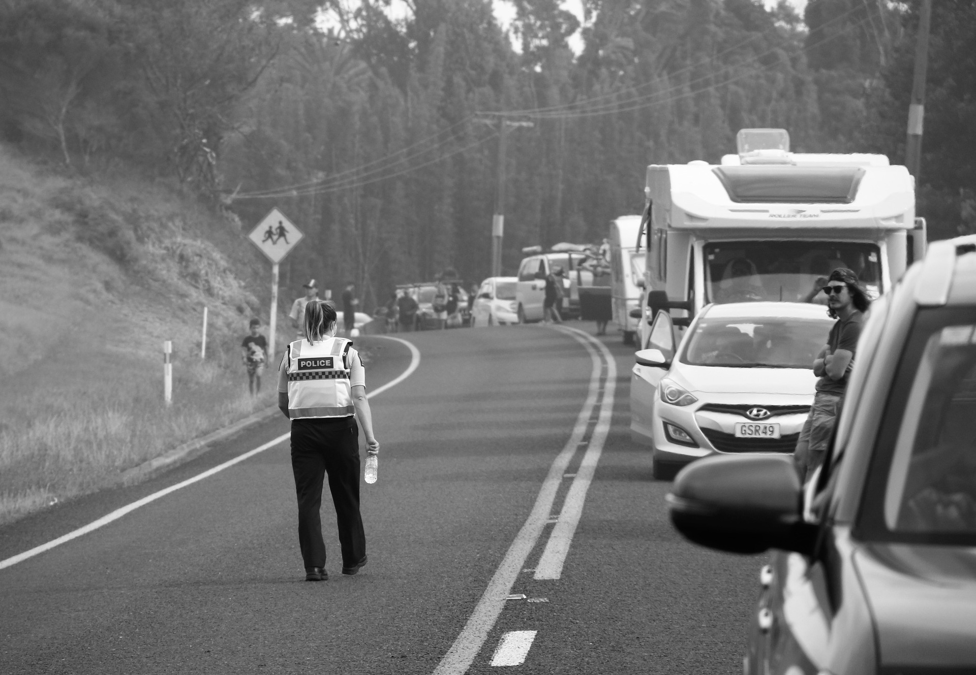 Holidaymakers wait for State Highway 1 to reopen after the Kaimaumau fire's Boxing Day breakout. Photo / Jada Rolston