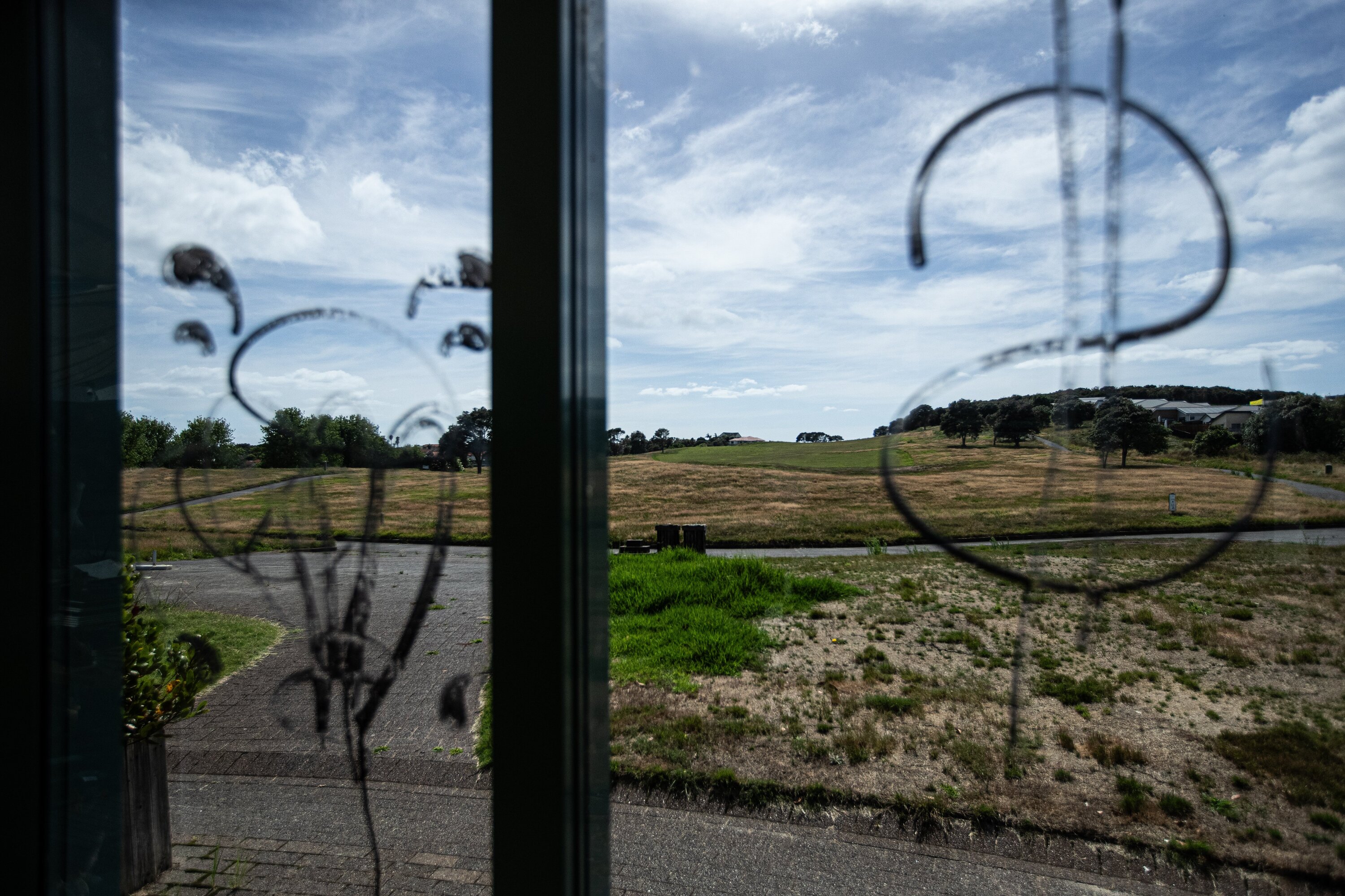 The Gulf Harbour golf course is weed-ridden and overgrown, and the clubhouse has been vandalised. Photo / Jason Dorday