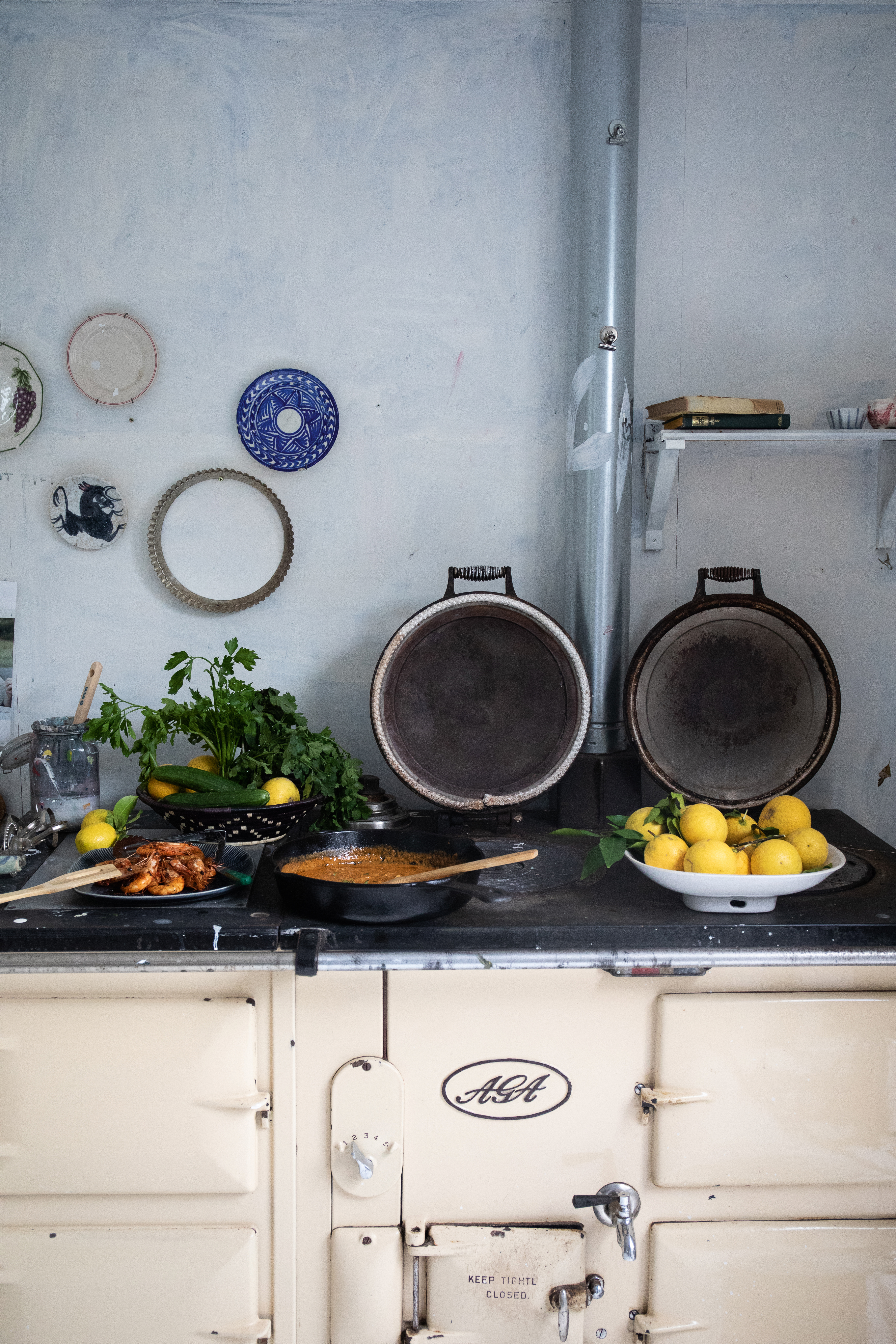 Corner of Zoe’s studio, featuring the family Aga stove, which she uses for both cooking and keeping the studio warm on cold winter mornings. Photo / Supplied