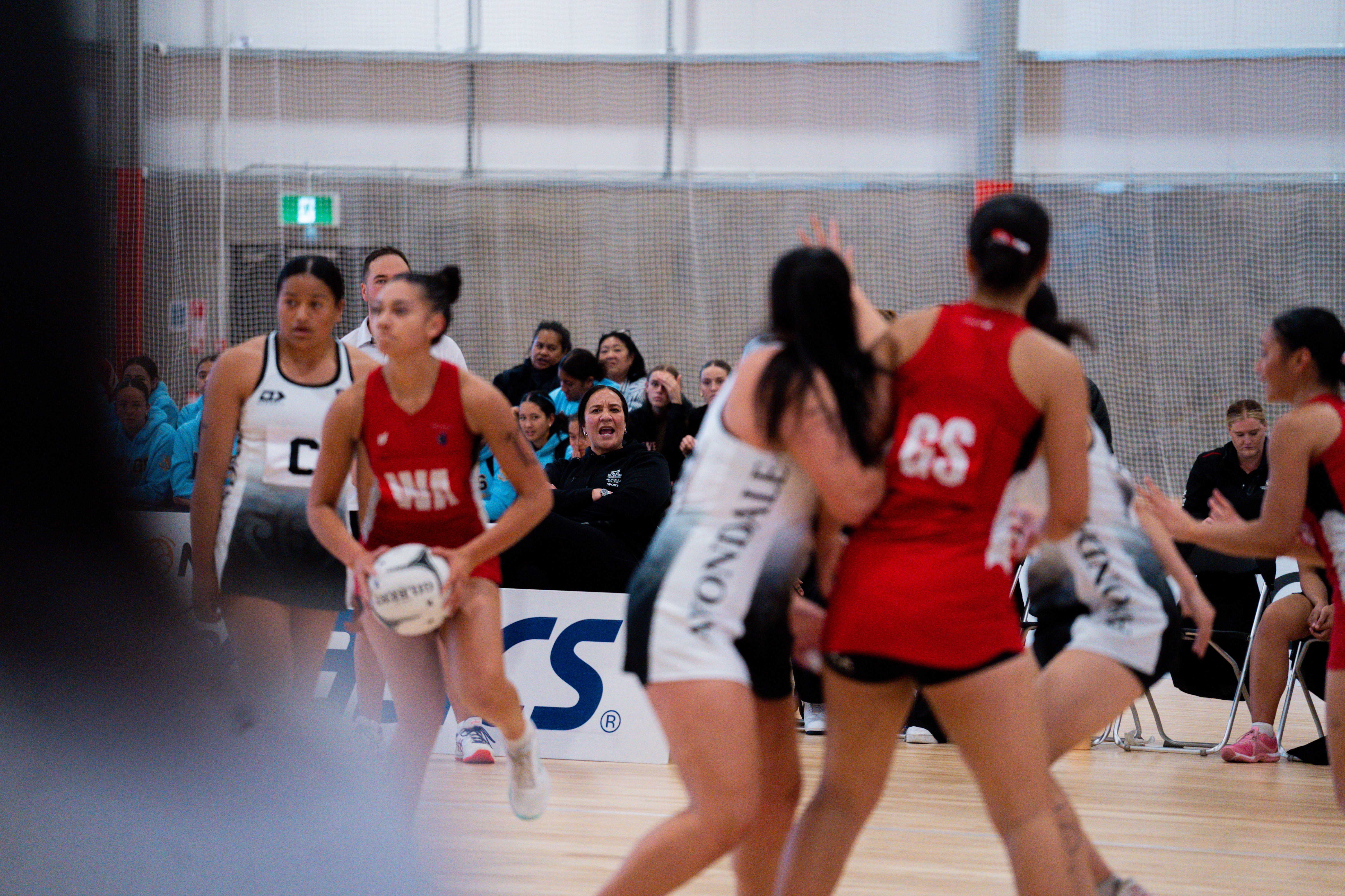 Rachel Rasmussen issuing instructions to her defenders as Howick College attack the Avondale College goal. Photo / Netball New Zealand