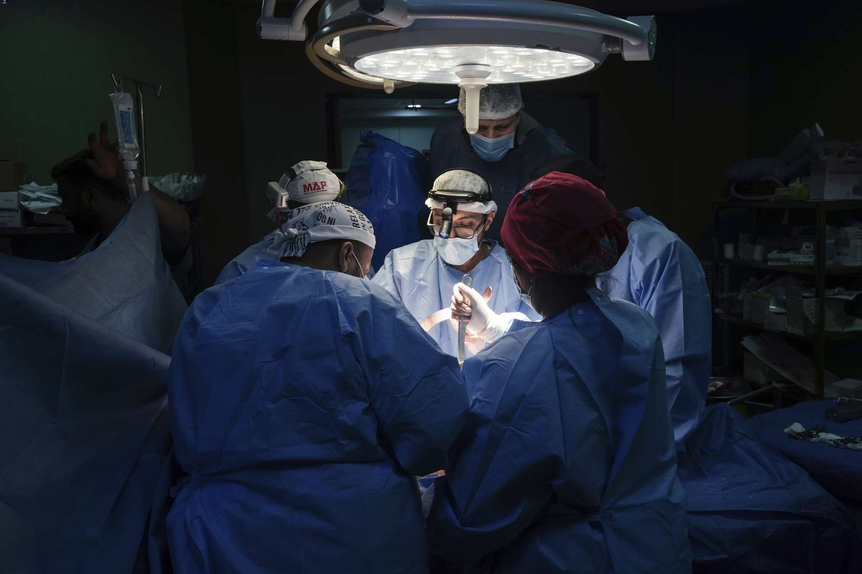 Doctors perform surgery on a patient at Al-Aqsa Martyrs Hospital, in Deir al-Balah, central Gaza. Photo / AP