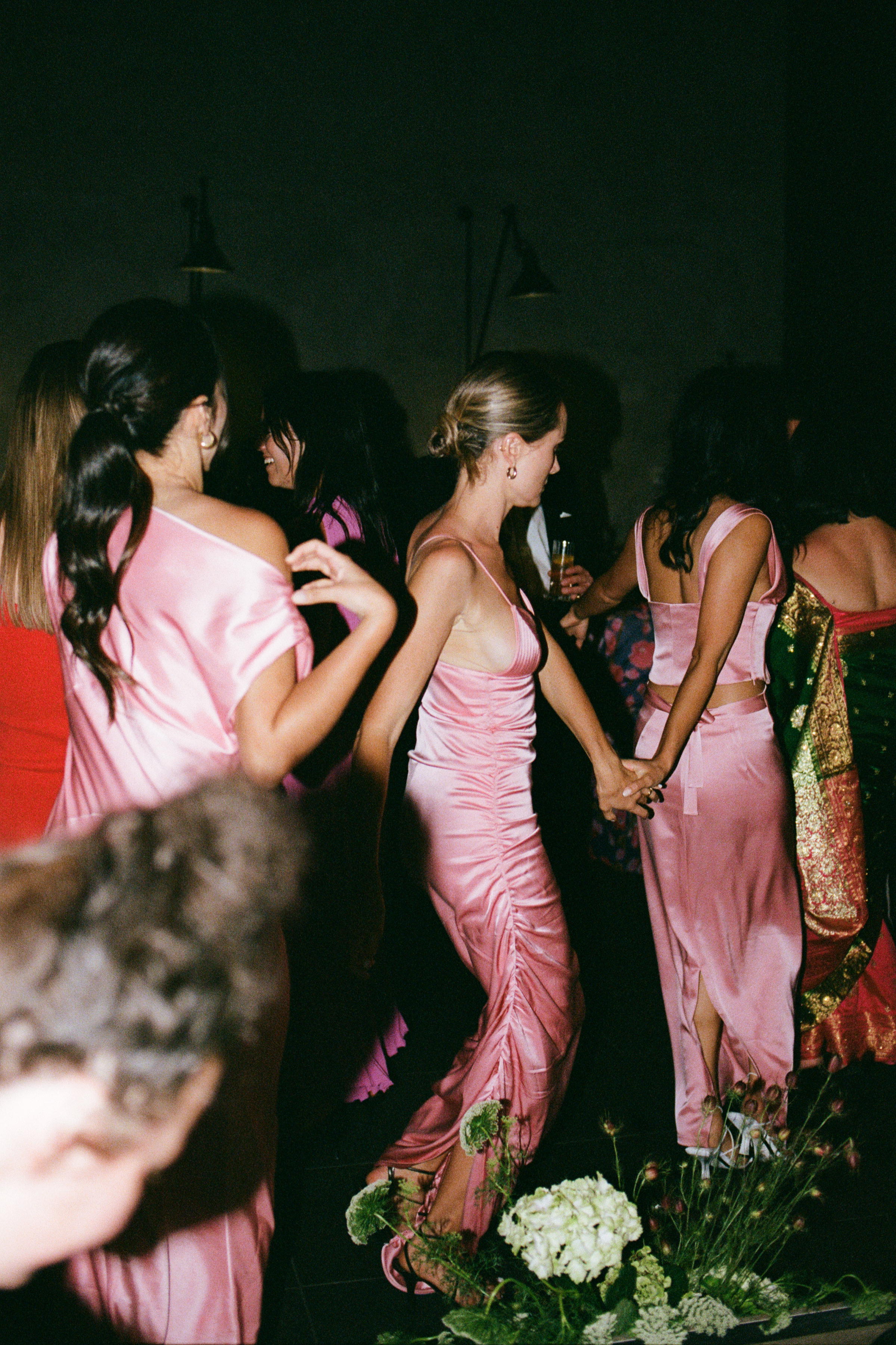 Anika leads her bridesmaids to the dancefloor in dusty pink dresses. Photos / Kaitlyn Clark