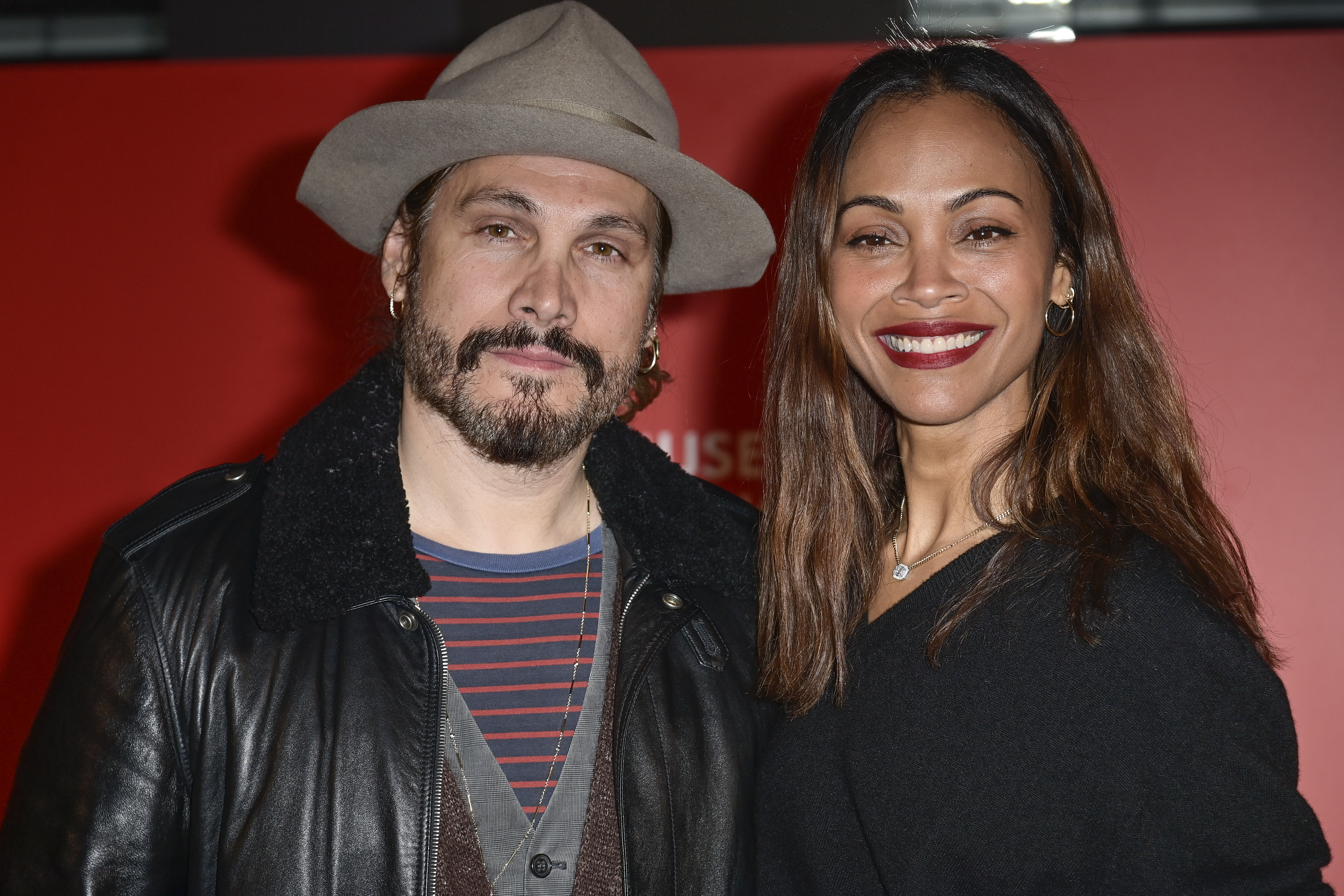 Zoe Saldana (R) and husband Marco Perego-Saldaña attend a photocall during the