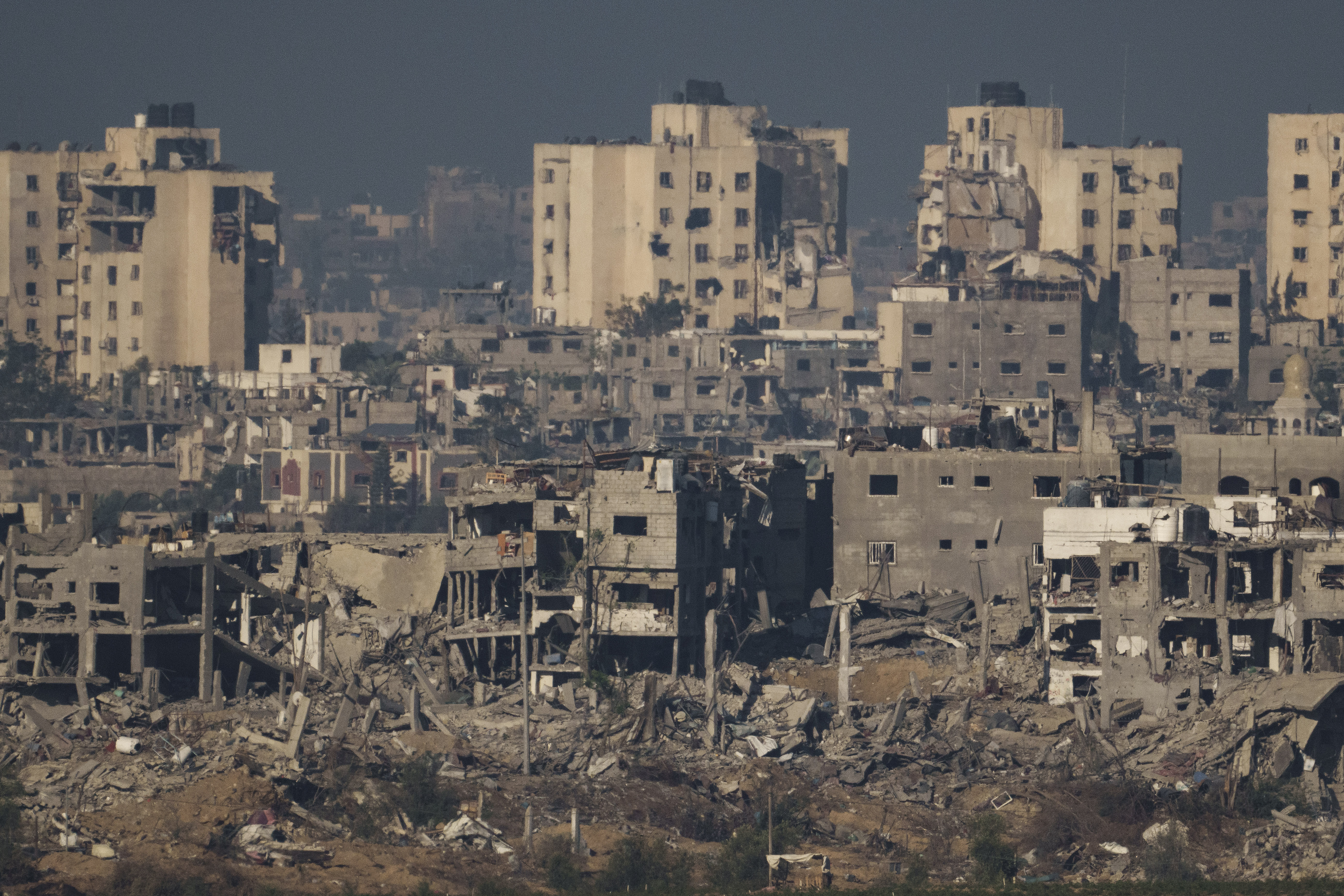 Destroyed buildings in the Gaza Strip, as seen from southern Israel on Thursday. Photo / AP