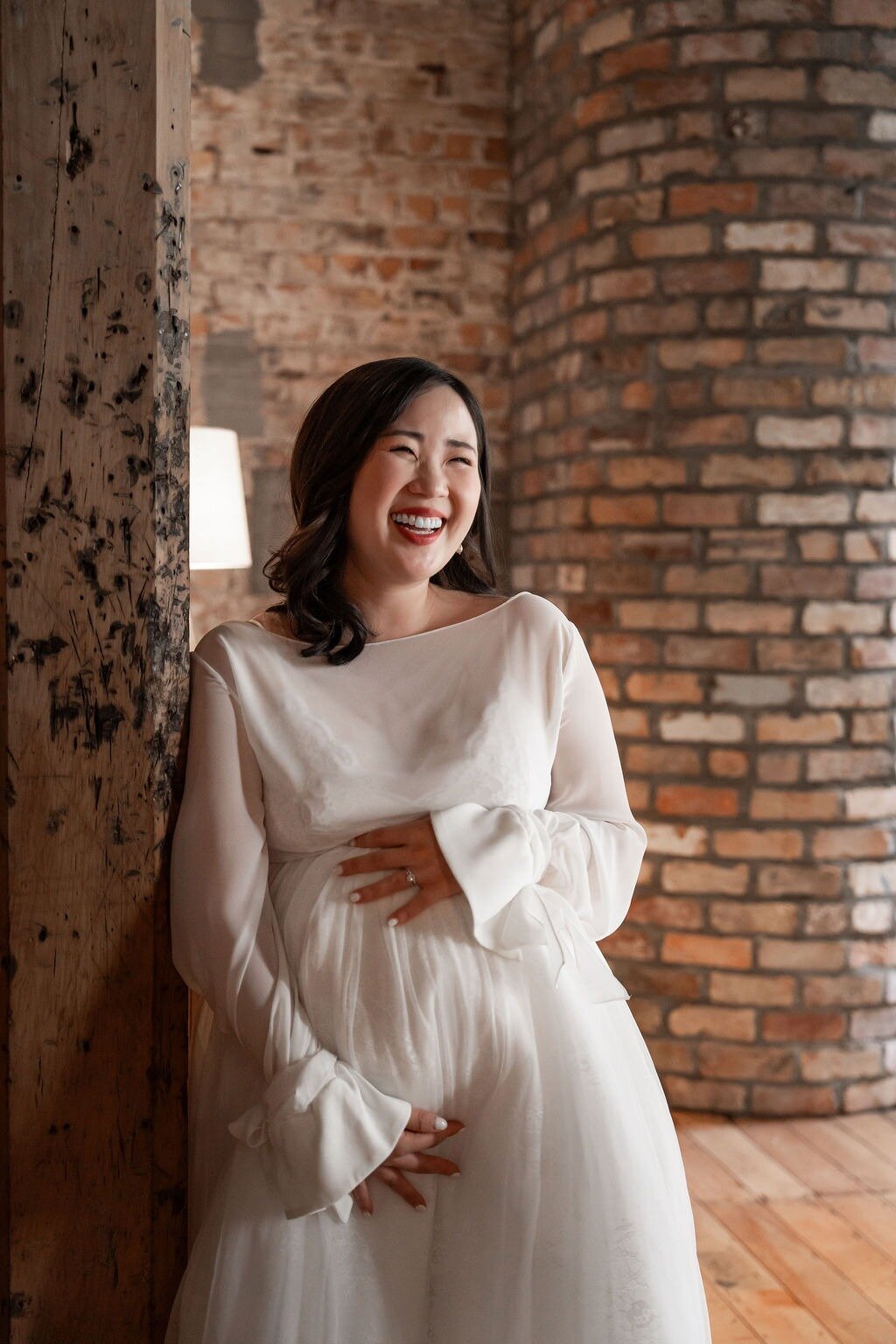 Elina wears Amara wrap and Vienna tulle: 'A moment of pure ease. Soft tulle, gentle sleeves, and a bride completely at home in her joy.' Photo / Supplied