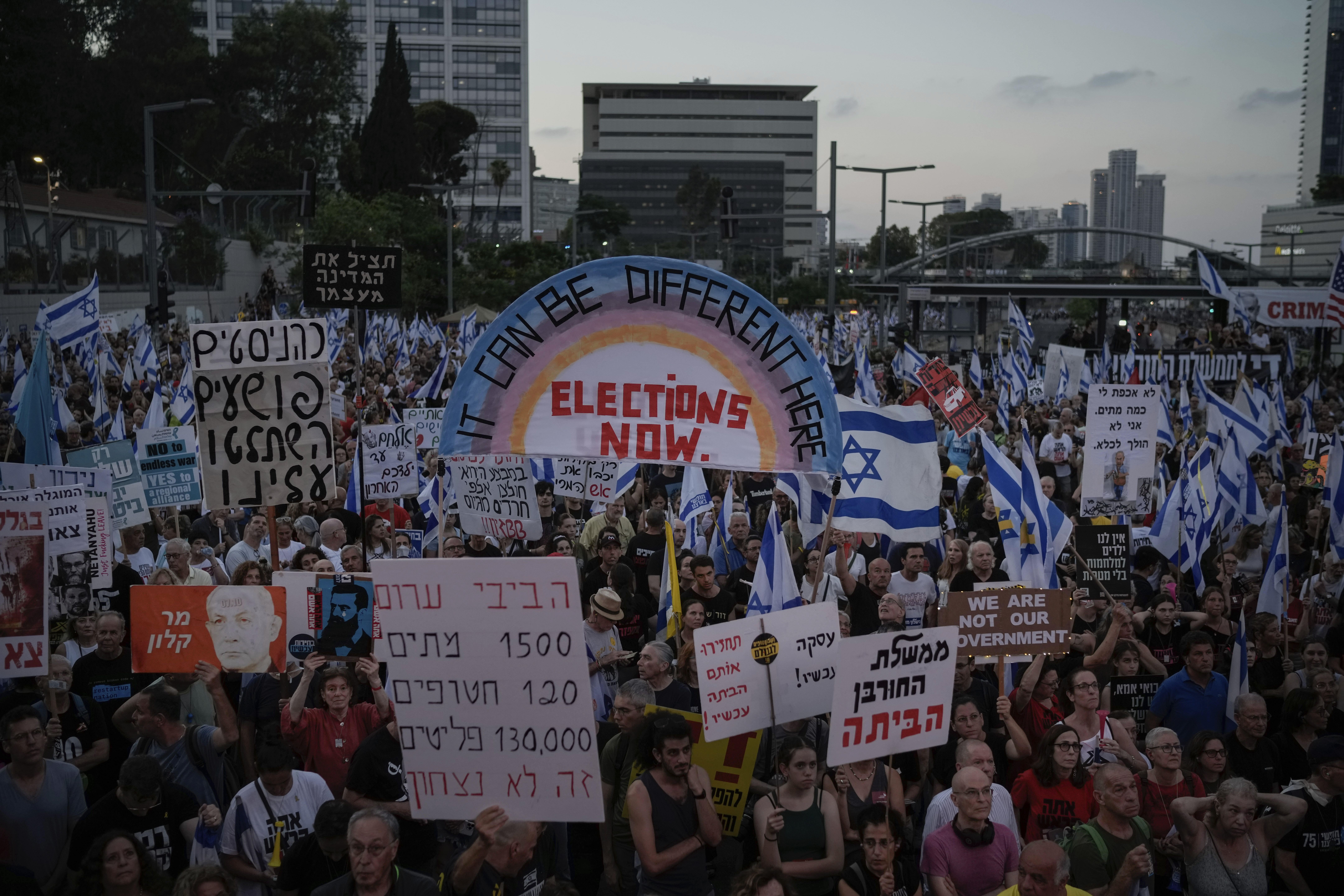 People attend a protest against Israeli Prime Minister Benjamin Netanyahu's government and demanding elections, in Tel Aviv, Israel. Photo / AP