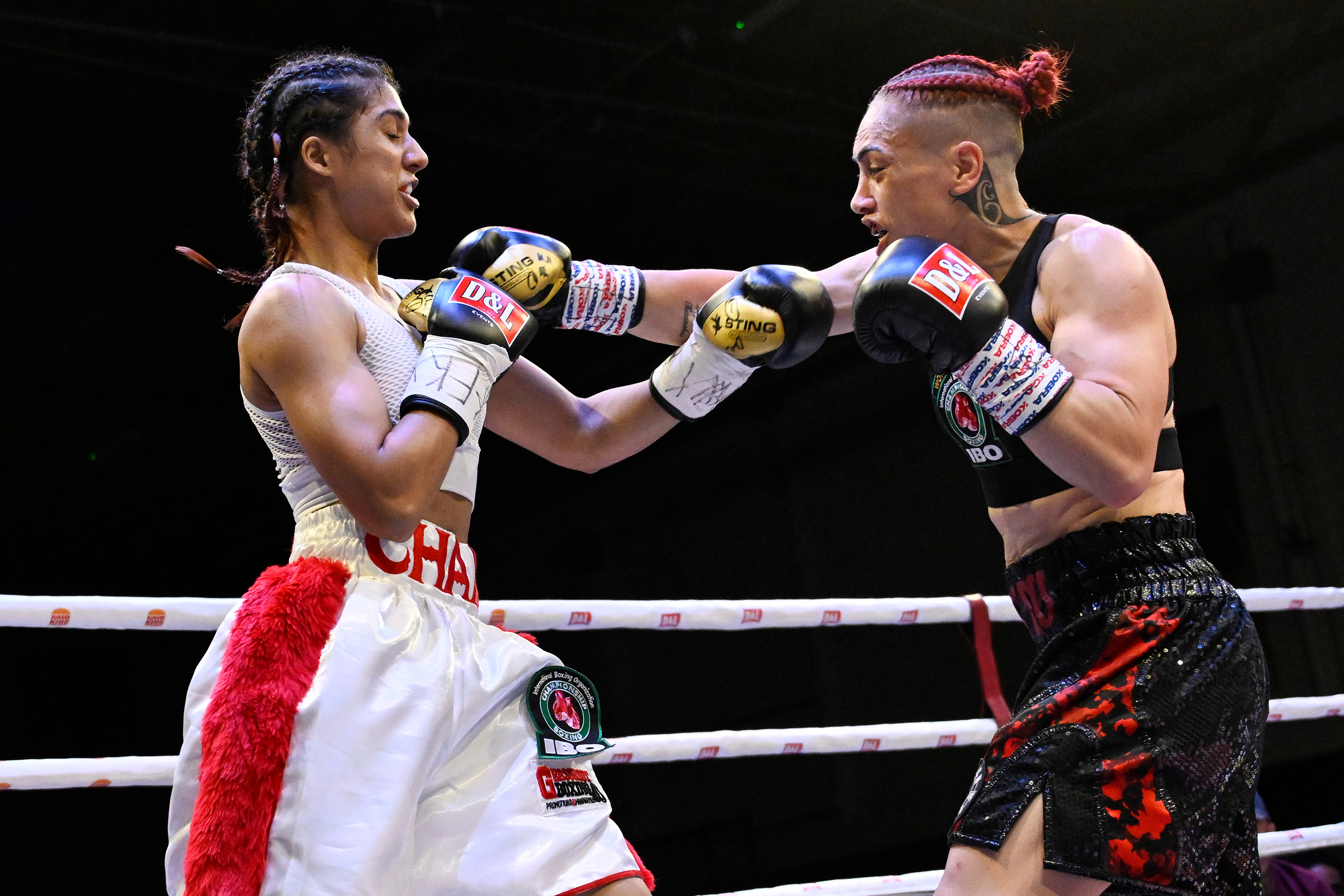 Mea Motu (right) beat Chandni Mehra to retain her IBO super bantamweight world title. Photo / Photosport