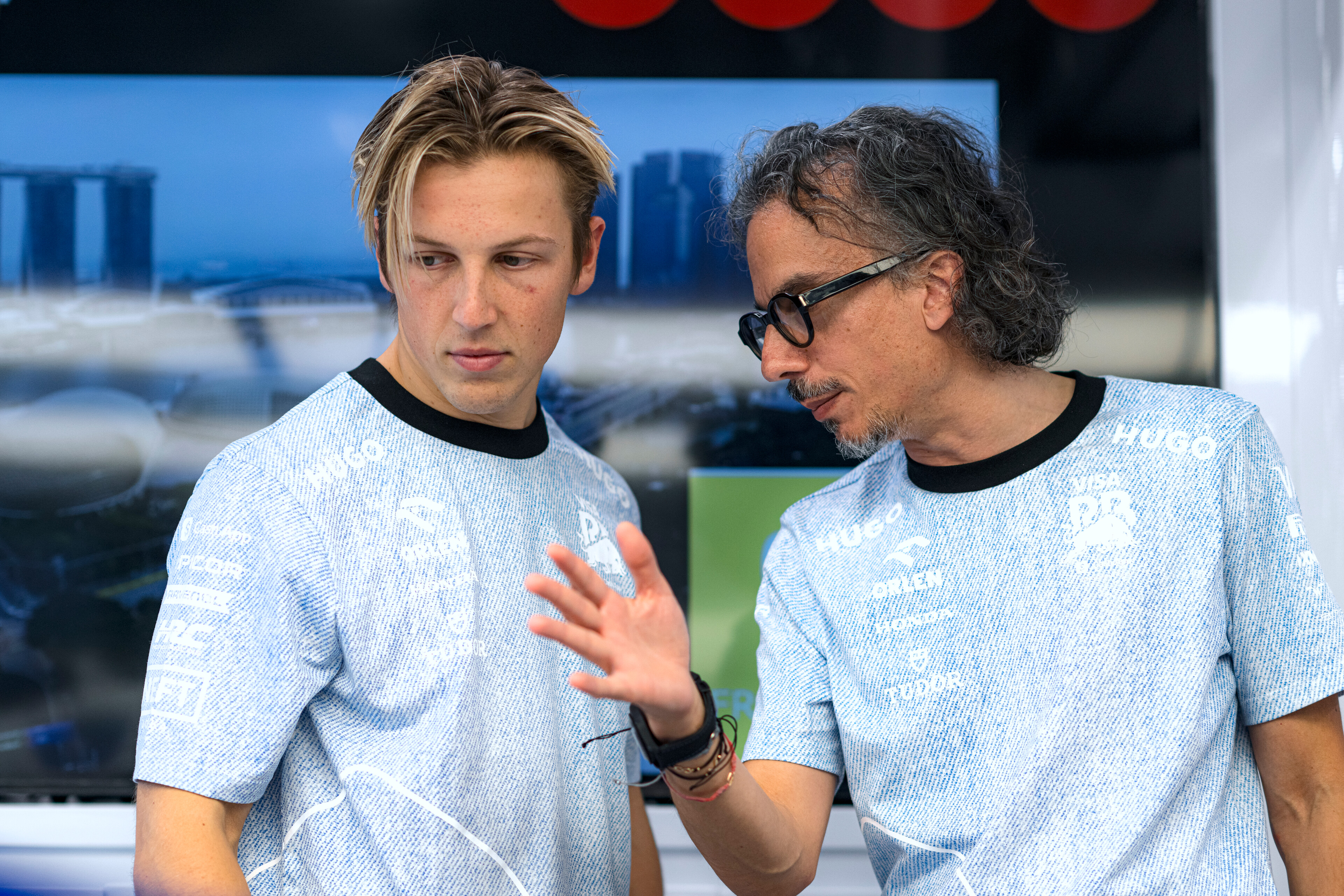 Liam Lawson with Red Bull team boss Laurent Mekies. Photo / Red Bull