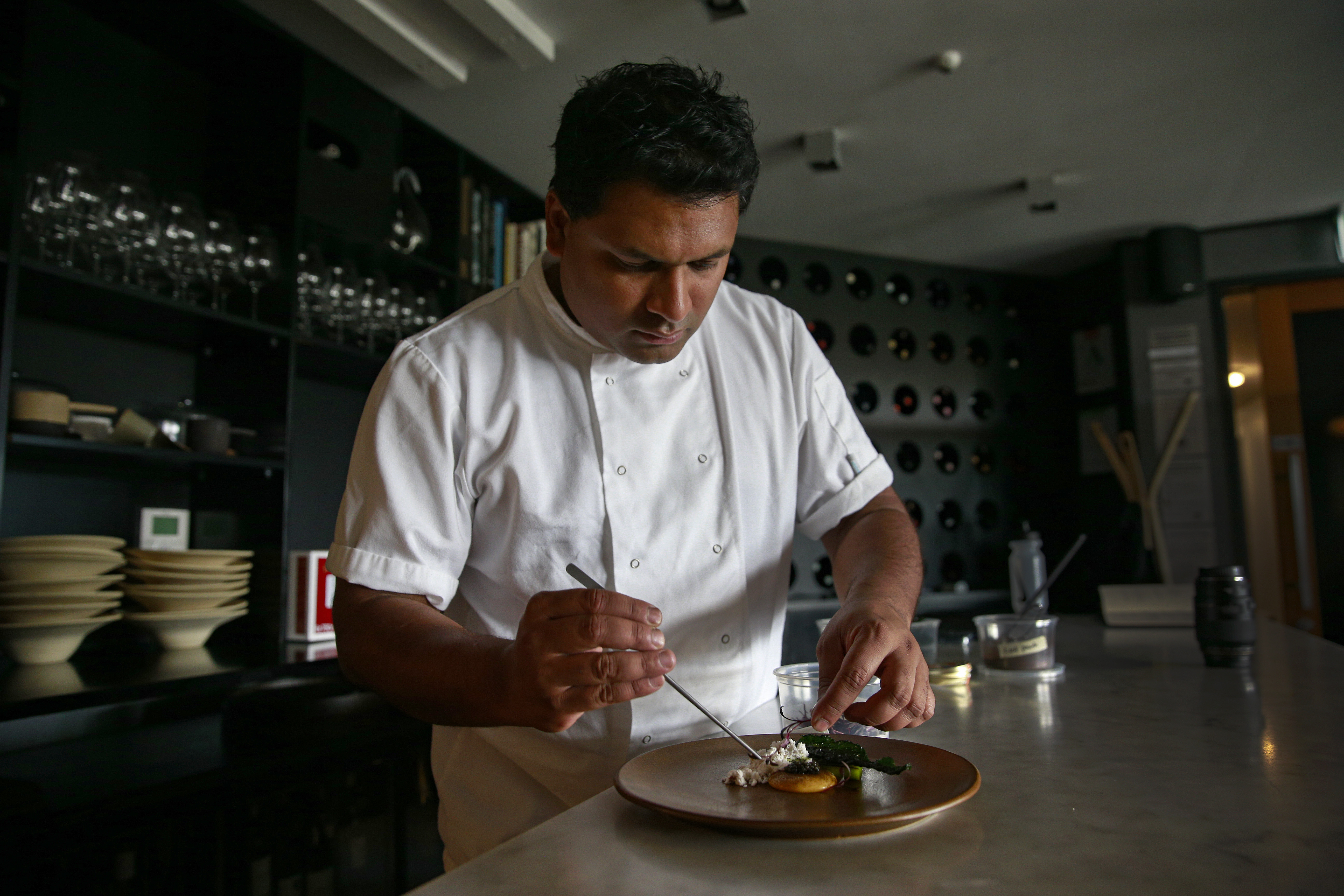Sidart chef and owner Lesley Chandra plates up a caviar course. Photo / Alex Burton 