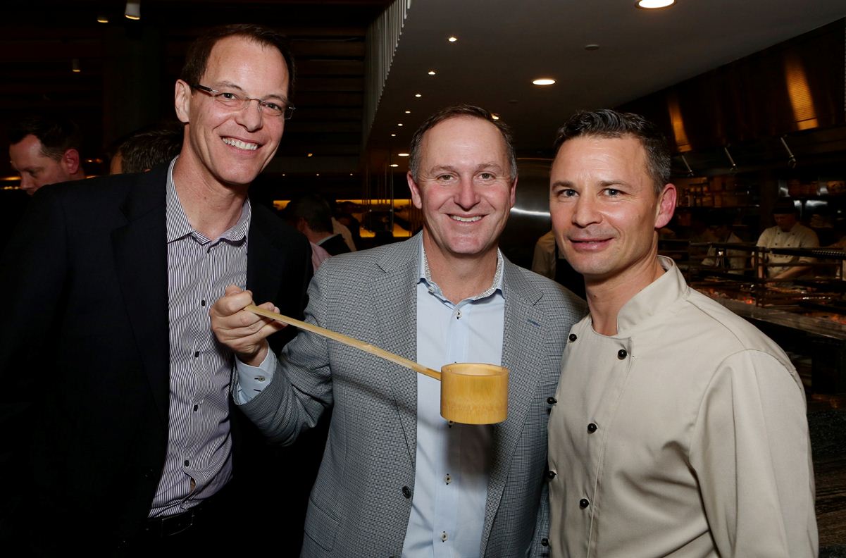 Guests at the 2013 Masu opening included newsreader Simon Dallow (left) and then Prime Minister Sir John Key, pictured with chef Nic Watt. 