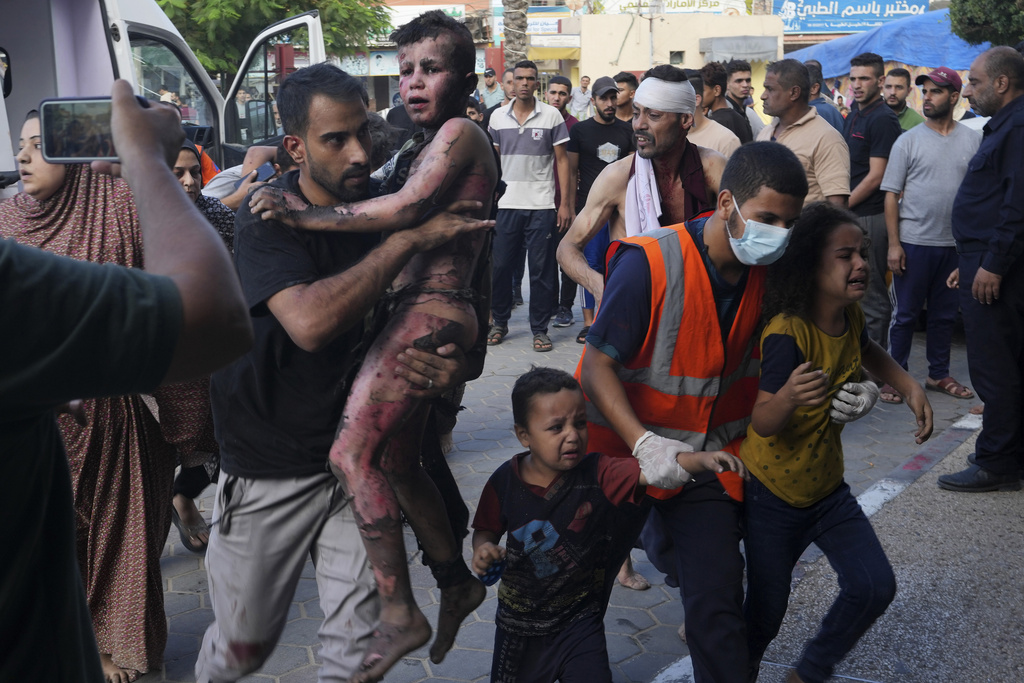 Palestinians wounded in the Israeli bombardment of the Gaza Strip are brought to a treatment room of al Aqsa Hospital in Deir al Balah on October 31. Photo / AP