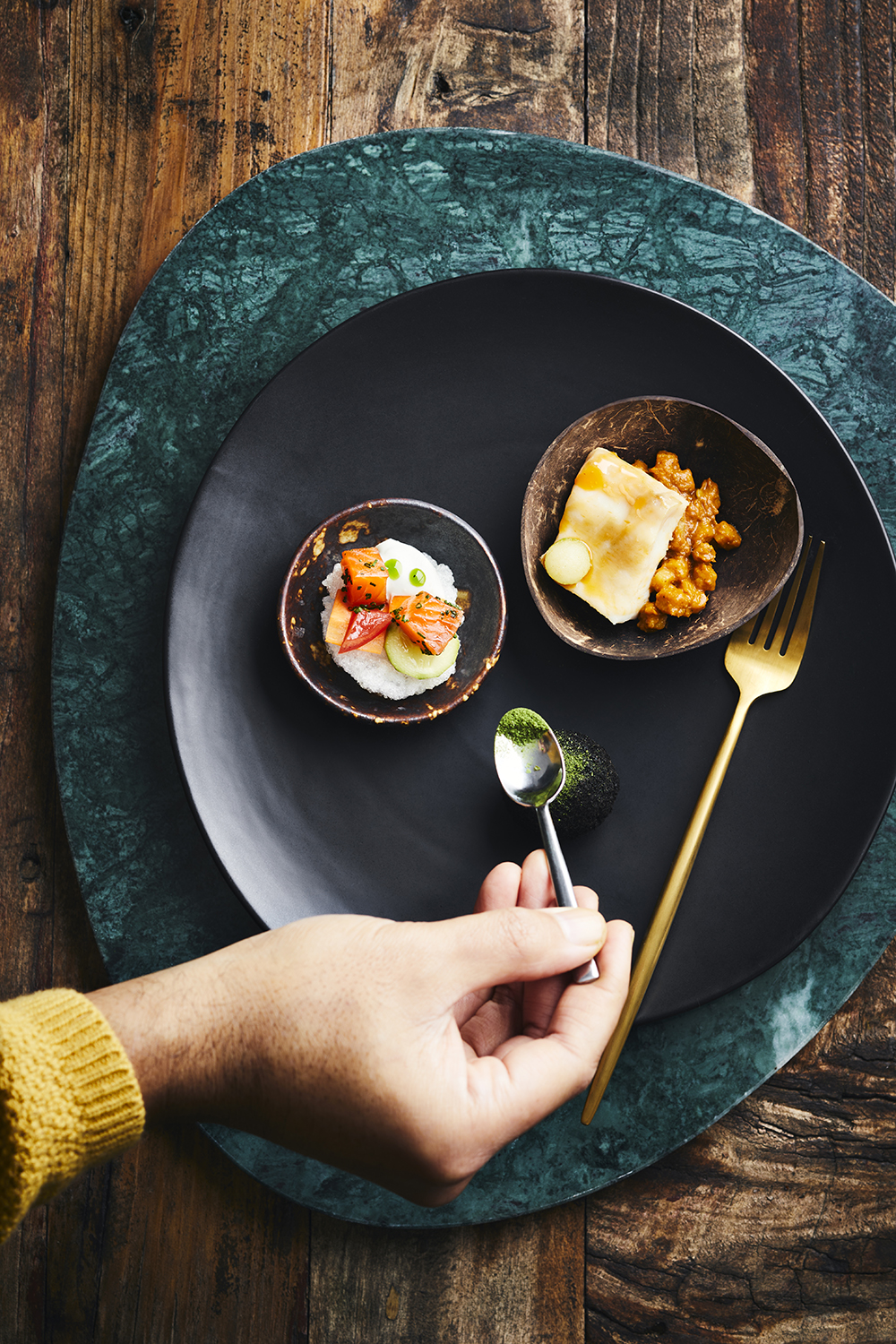 At Tala, the menu is a play on chef Henry Onesemo’s childhood memories. Pictured is cured salmon on sago cracker with coconut wasabi and fish curry with green banana and Palusami croquet. Photo / Manja Wachsmuth