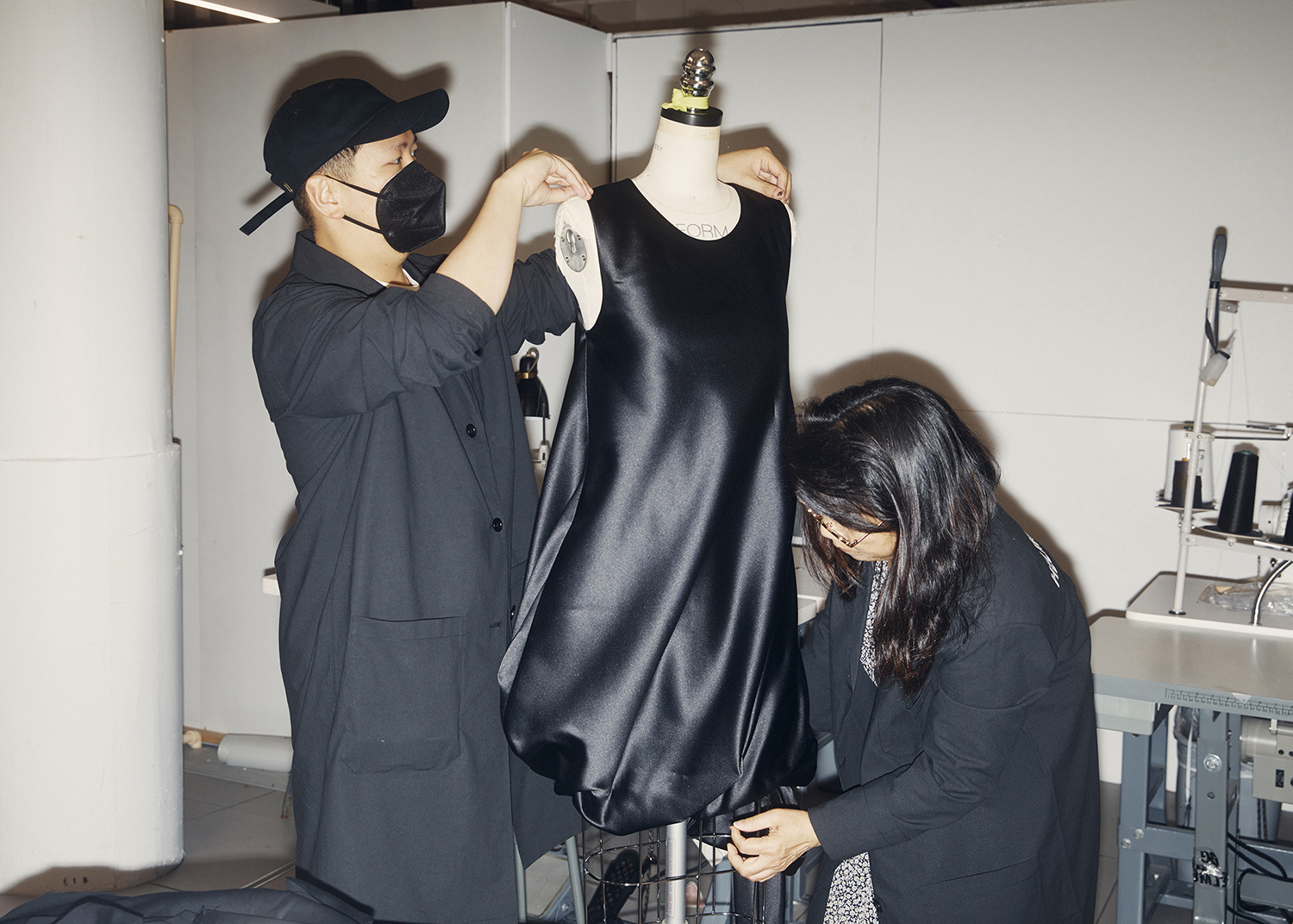 Peter Do works on an unfinished dress in the Helmut Lang atelier in New York. Photo / Erik Tanner, The New York Times