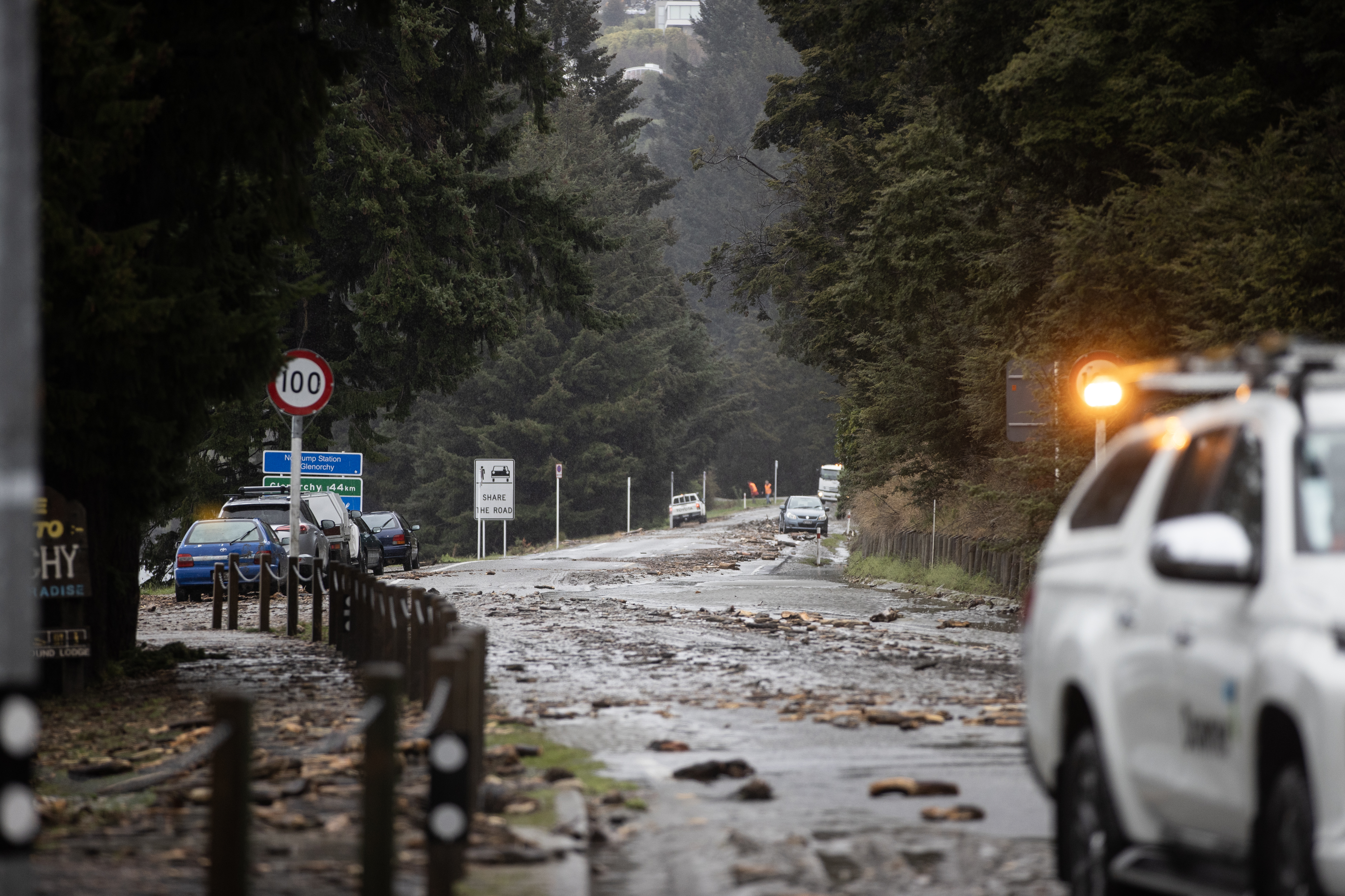 Debris covers the road to Glenorchy just outside Queenstown on Friday morning. Photo / George Heard