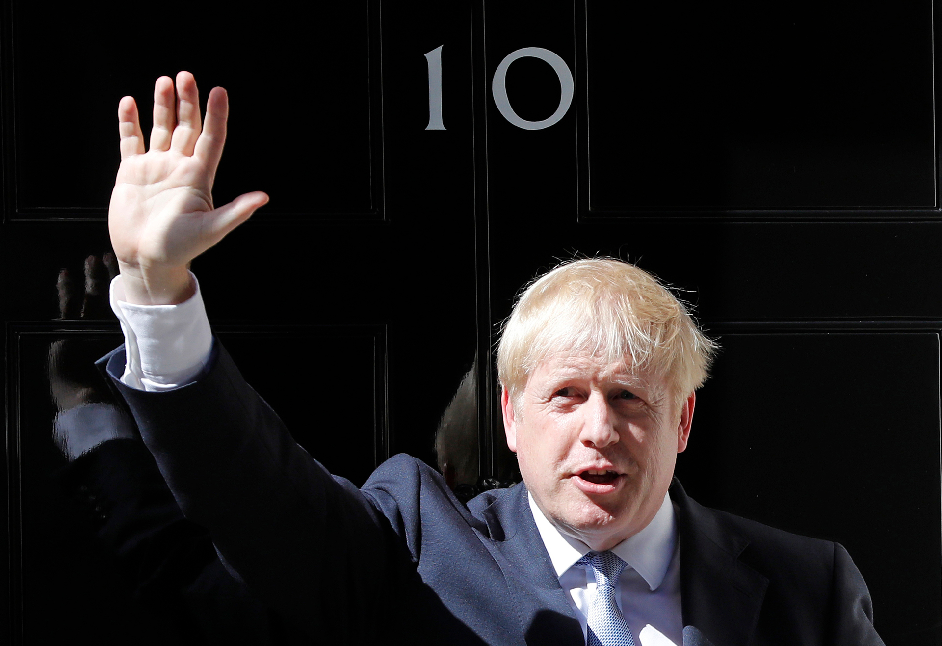 Britain's new Prime Minister Boris Johnson waves from the steps outside 10 Downing Street. Photo / AP
