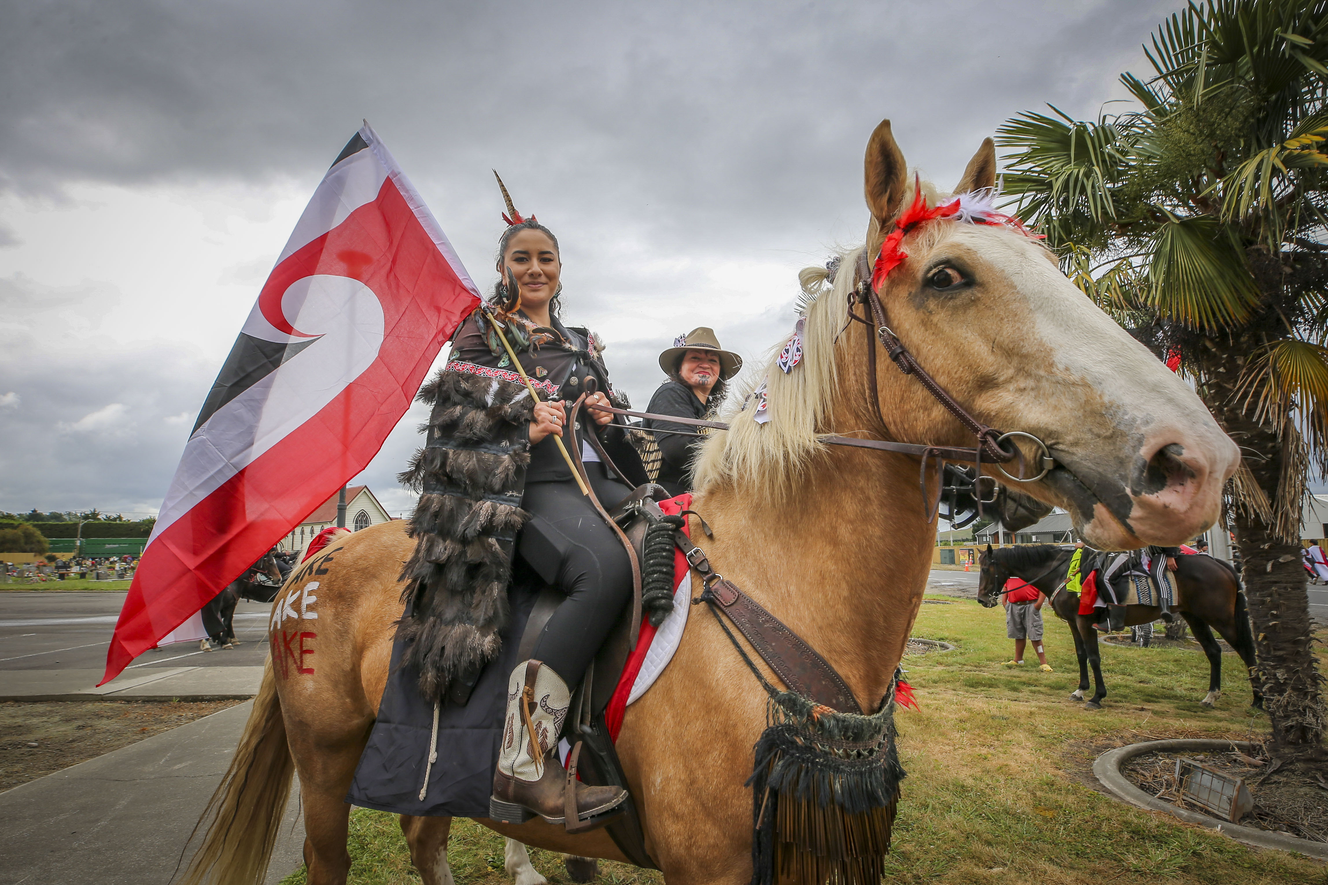 Hīkoi supporters, many on horseback, gather in Omāhu. Photo / Paul Taylor