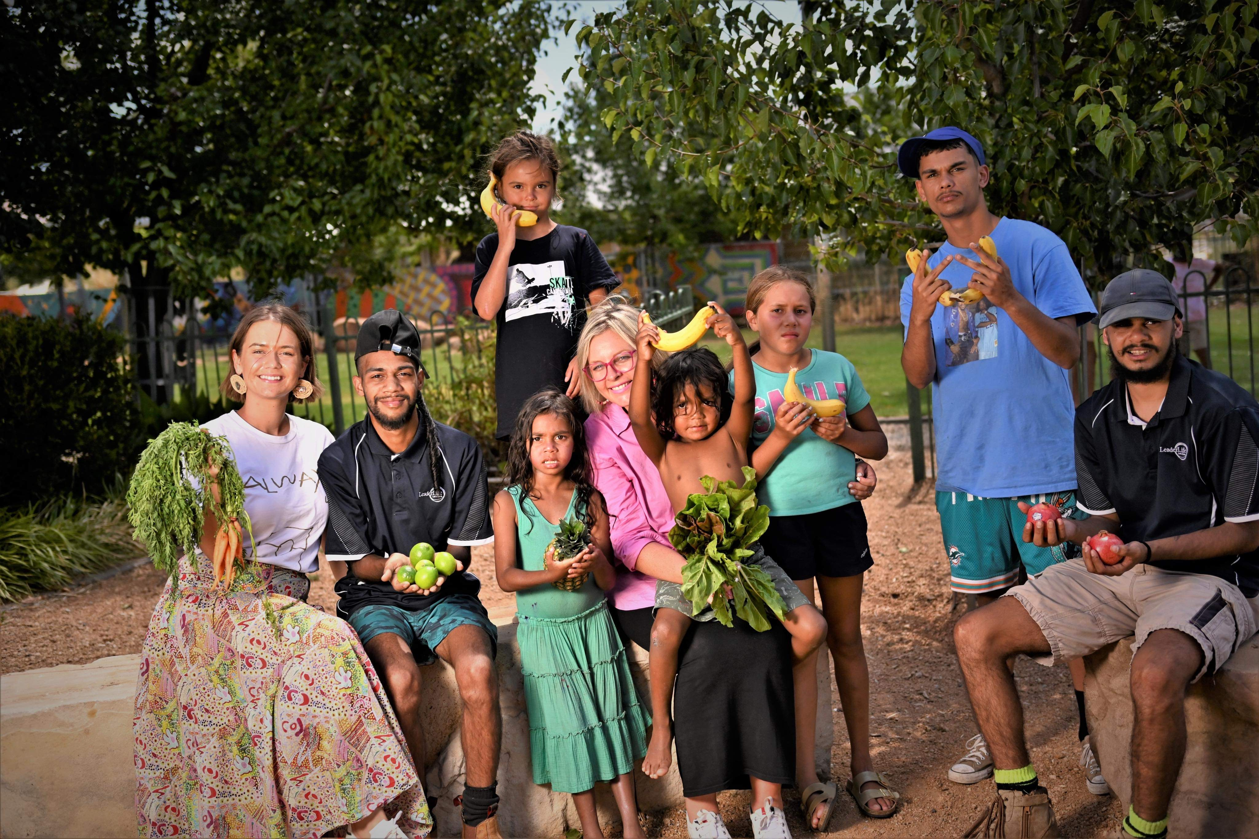 Joh Leader (centre) and the kids she works with in Dubbo. Photo / LeaderLife