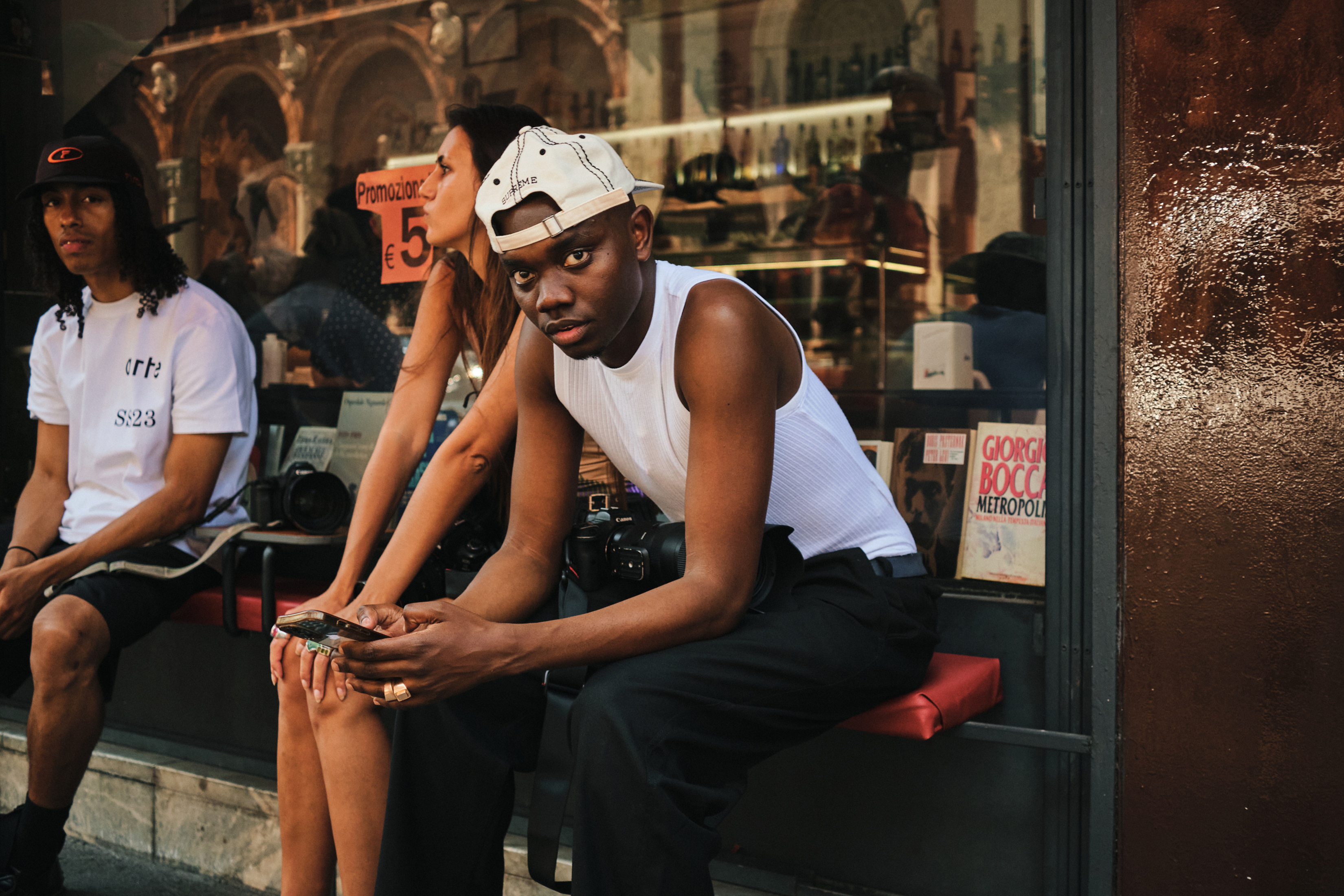 Stacked gold rings paired with a ribbed white tank, in Milan. Photo / Simbarashe Cha, The New York Times
