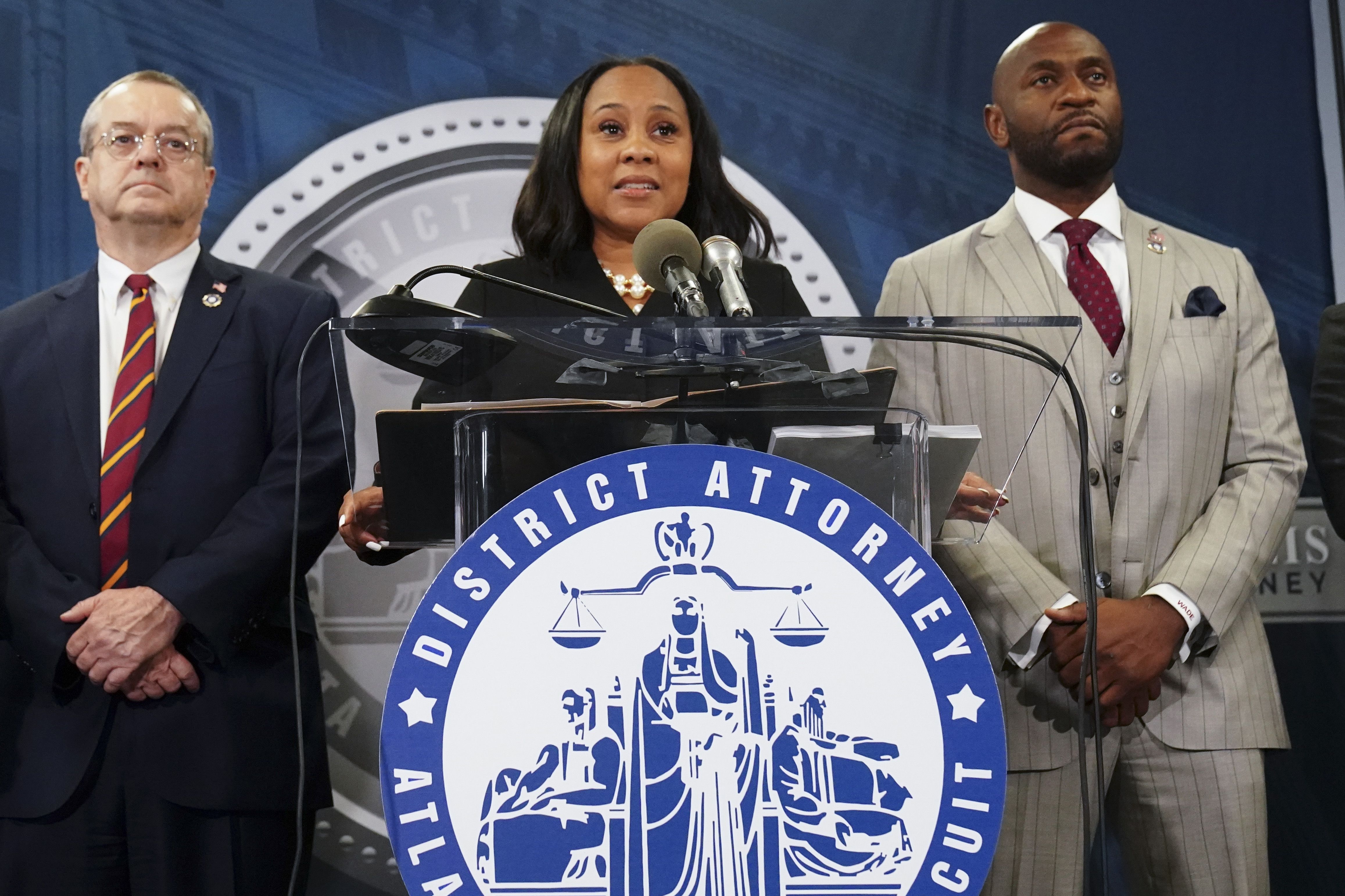 Fulton County District Attorney Fani Willis (centre), speaking in the Fulton County Government Center. Photo / John Bazemore, AP