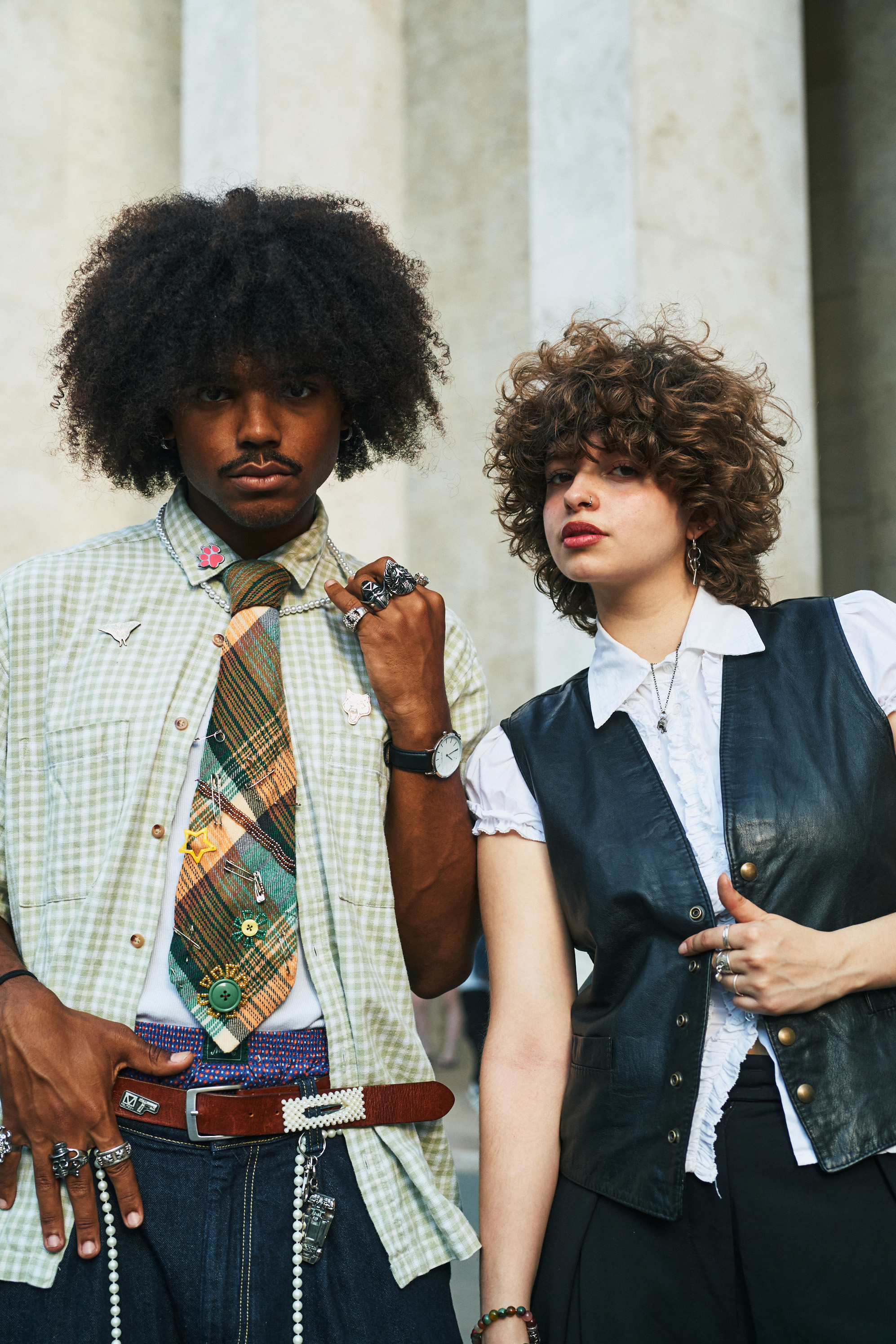 A streetwear pair with thoughtful fashion touches and many, many rings. Photo / New York Times