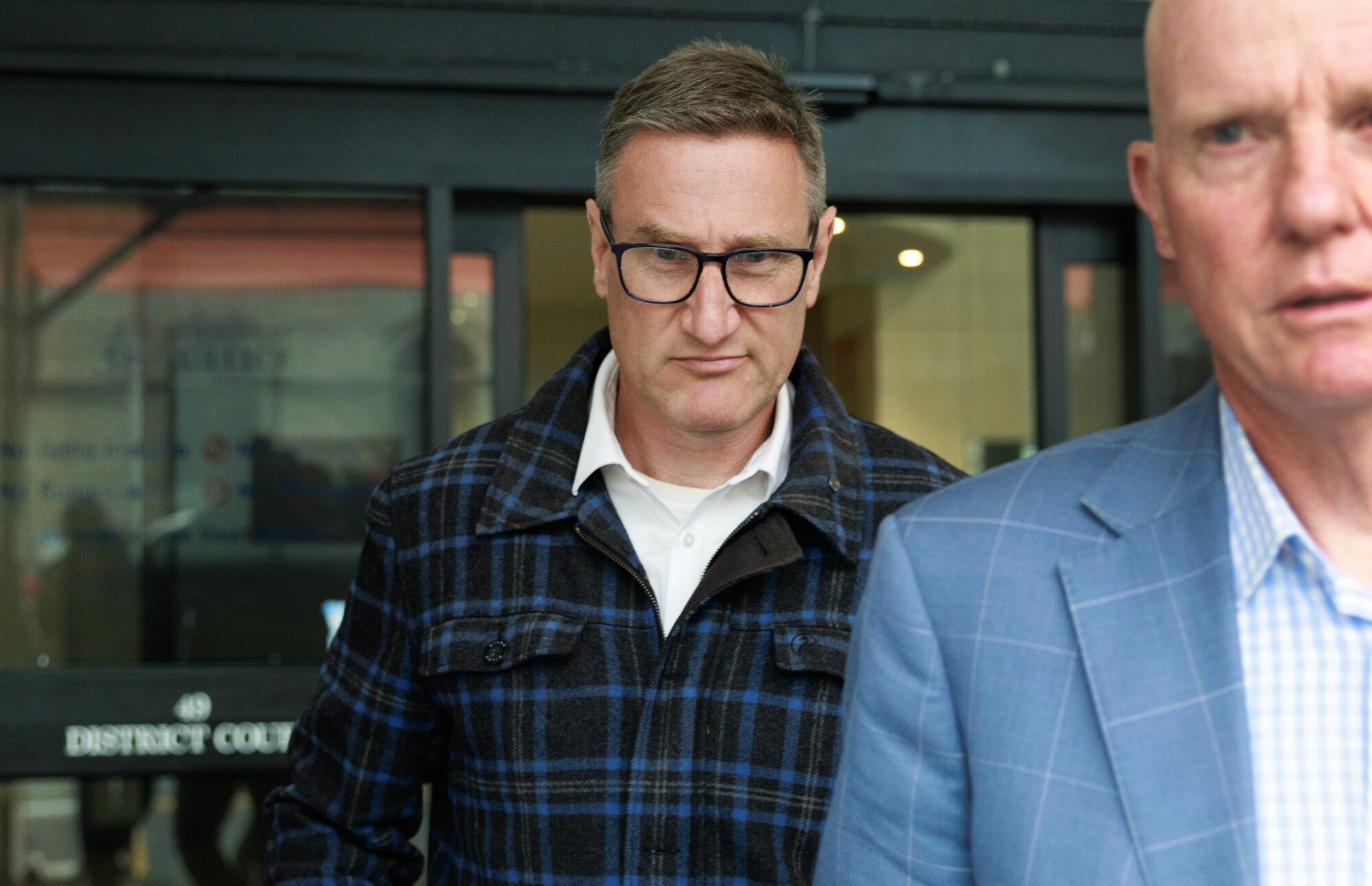 Former deputy police commissioner Jevon McSkimming (centre) outside court after pleading guilty to possession of objectionable material. Photo / Mark Mitchell