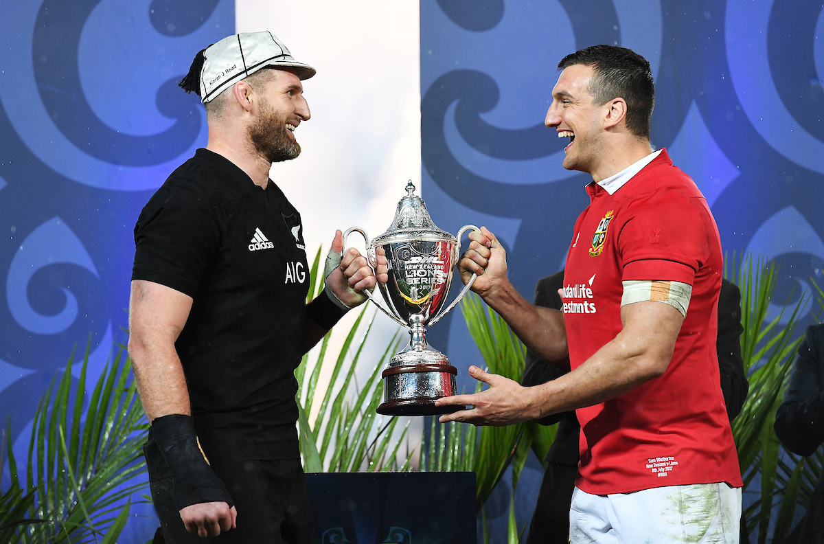 Kieran Read and Sam Warburton share the 2017 Lions tour trophy. Photo / Photosport