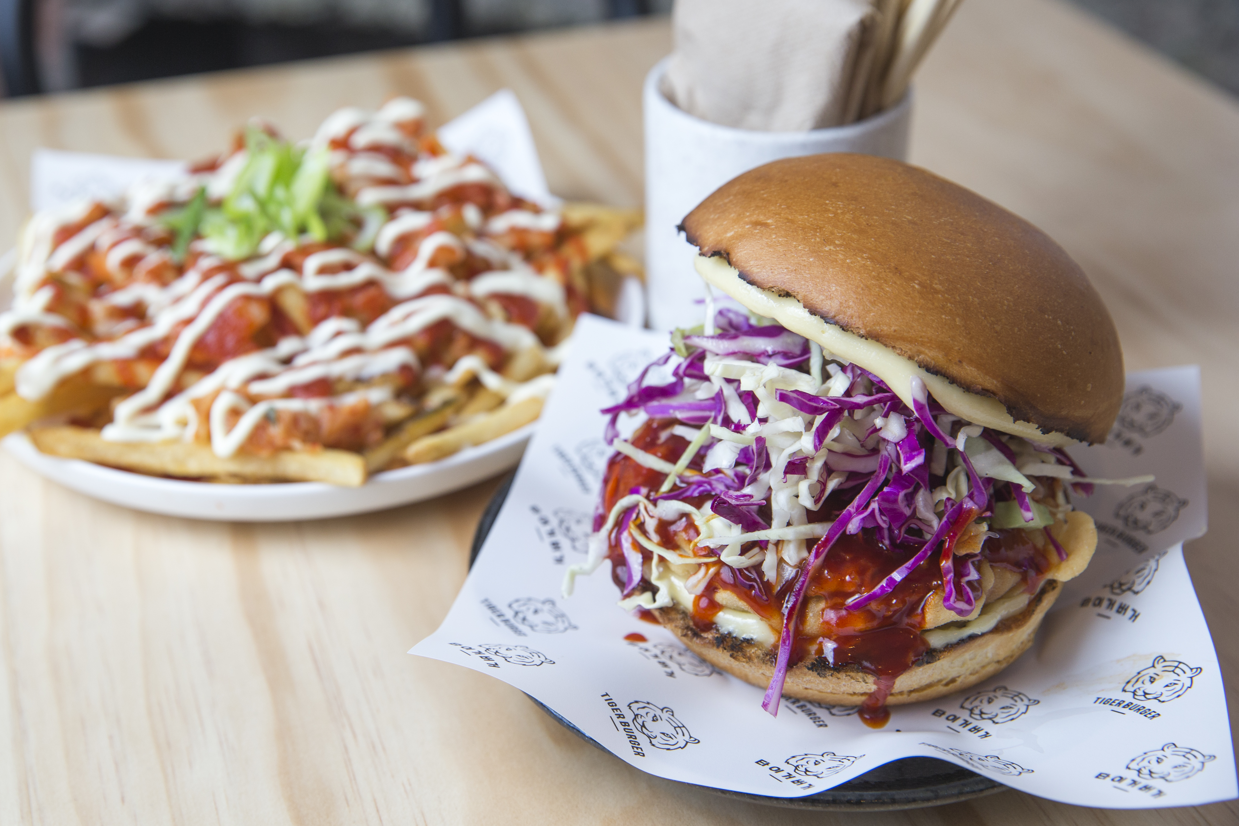 Kimcheese Fries and Goguma Burger (Crispy Shiitake & Kumara Patty, Slaw, Yang Nyum Sauce and Mayo) from Tiger Burger. Photo / Greg Bowker