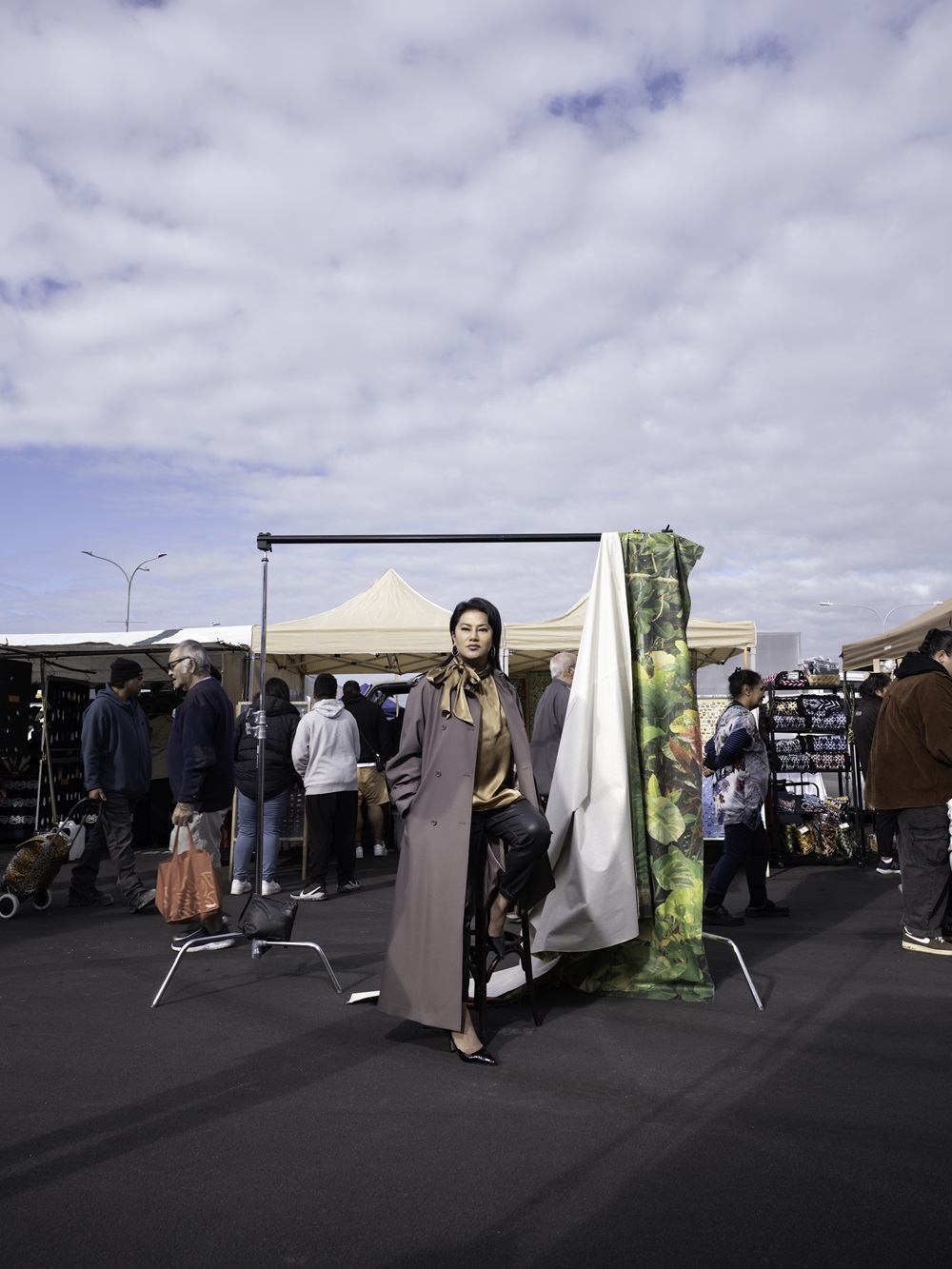 Yuki wears Shjark blouse, Ruby trenchcoat and Swarovski earrings. Leather trousers and heels Yuki's own. Photo / Gui Taccetti