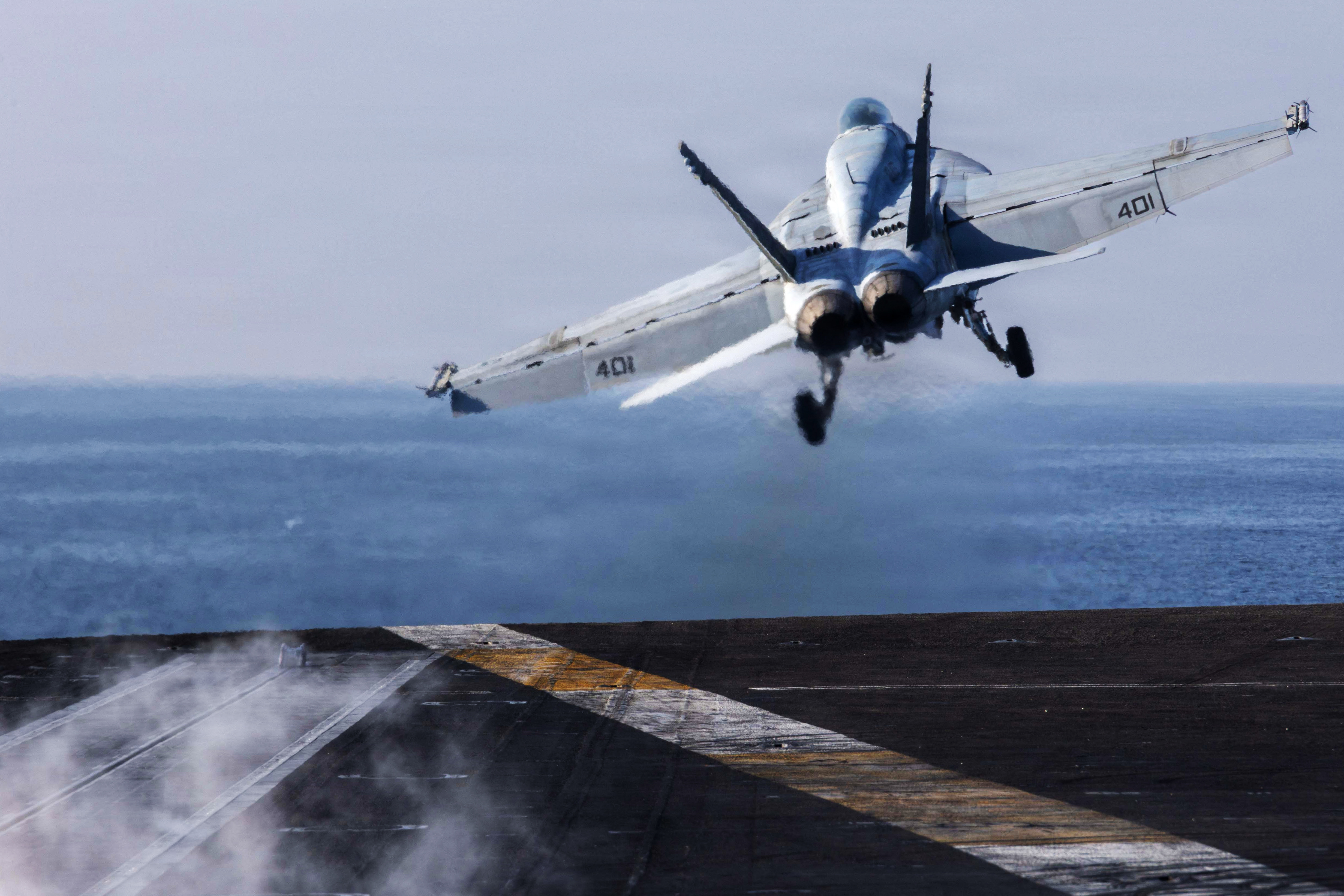 A US Navy F/A-18E Super Hornet launching from the flight deck of Nimitz-class aircraft carrier USS Abraham Lincoln on the weekend. Photo / AFP, US Centcom, US Navy
