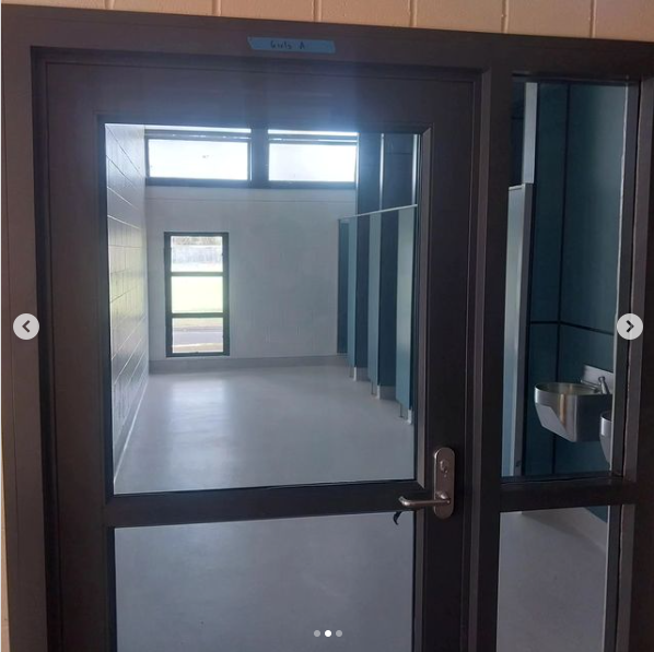 Big glass doors have been installed in the new Green Bay High School bathroom for 