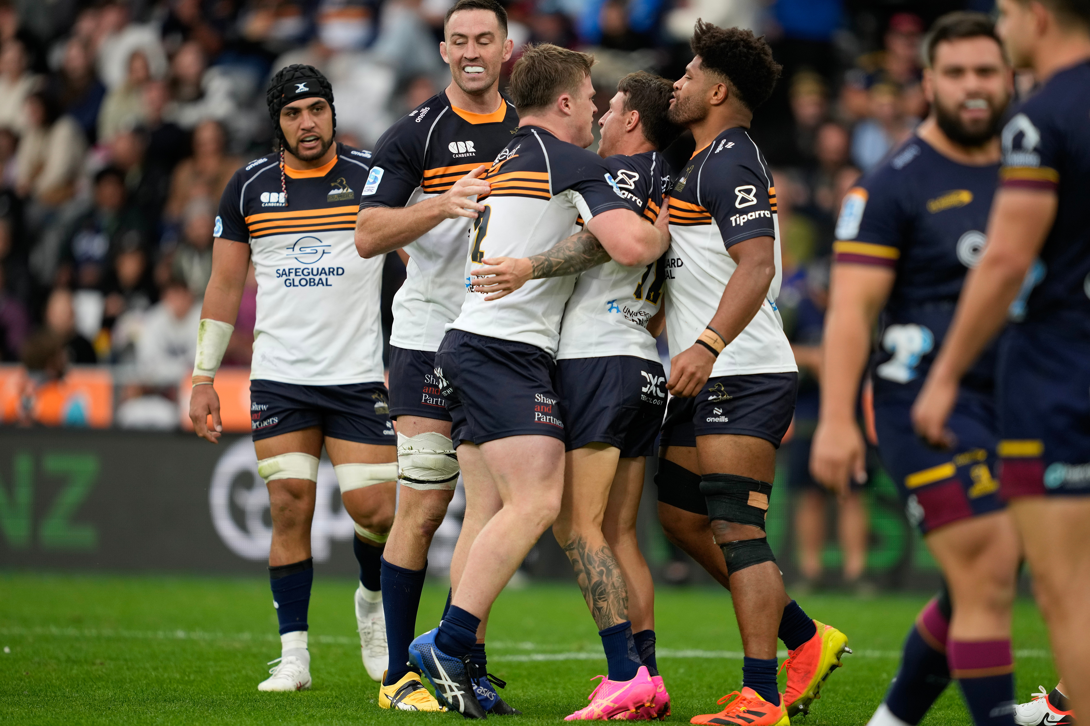 The Brumbies celebrate Corey Toole's try against the Highlanders. Photo / Photosport