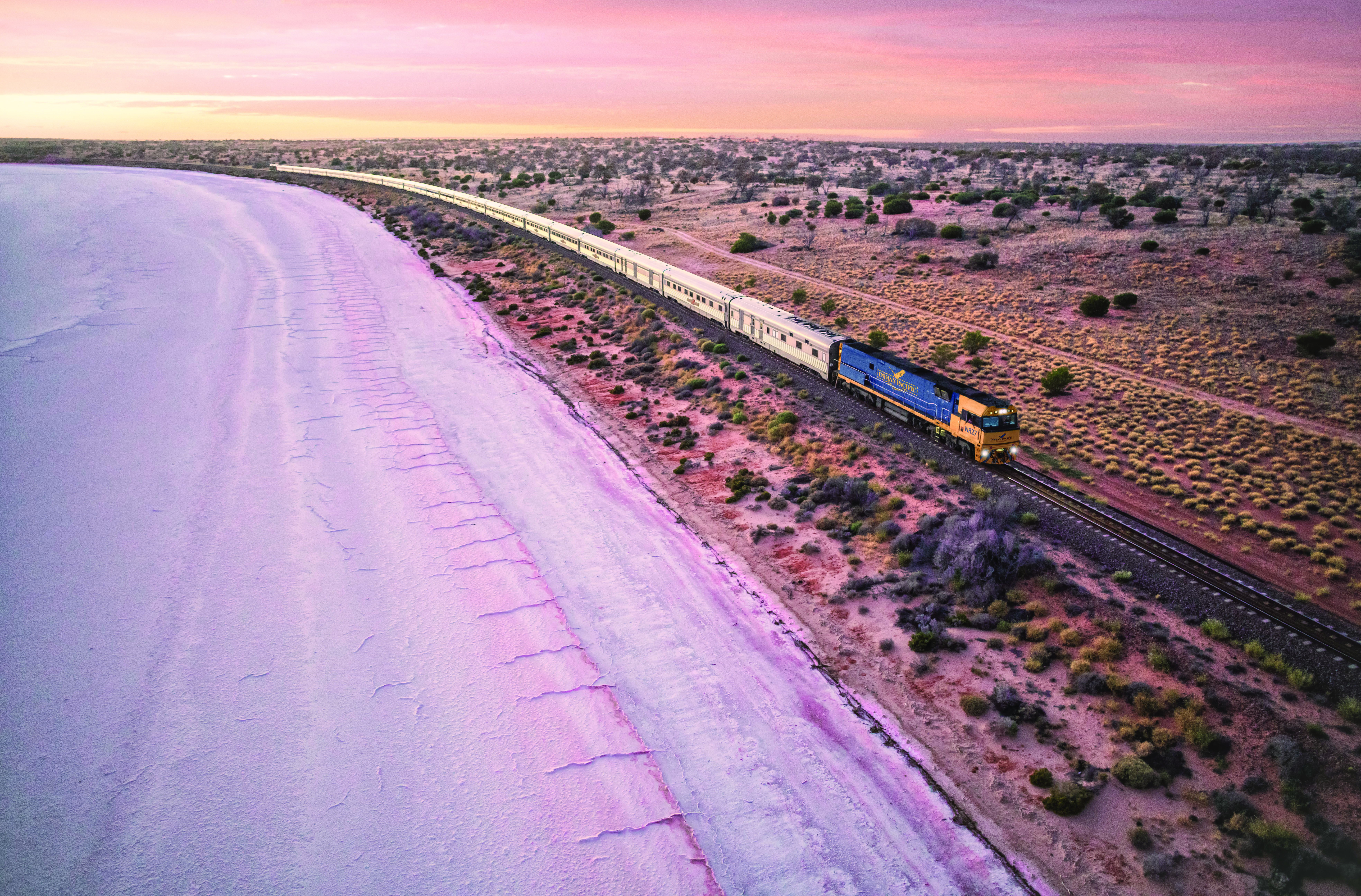 The Indian Pacific travelling past the salt expanse of Lake Hart, north of Woomera, in Australia. Photo /  Supplied