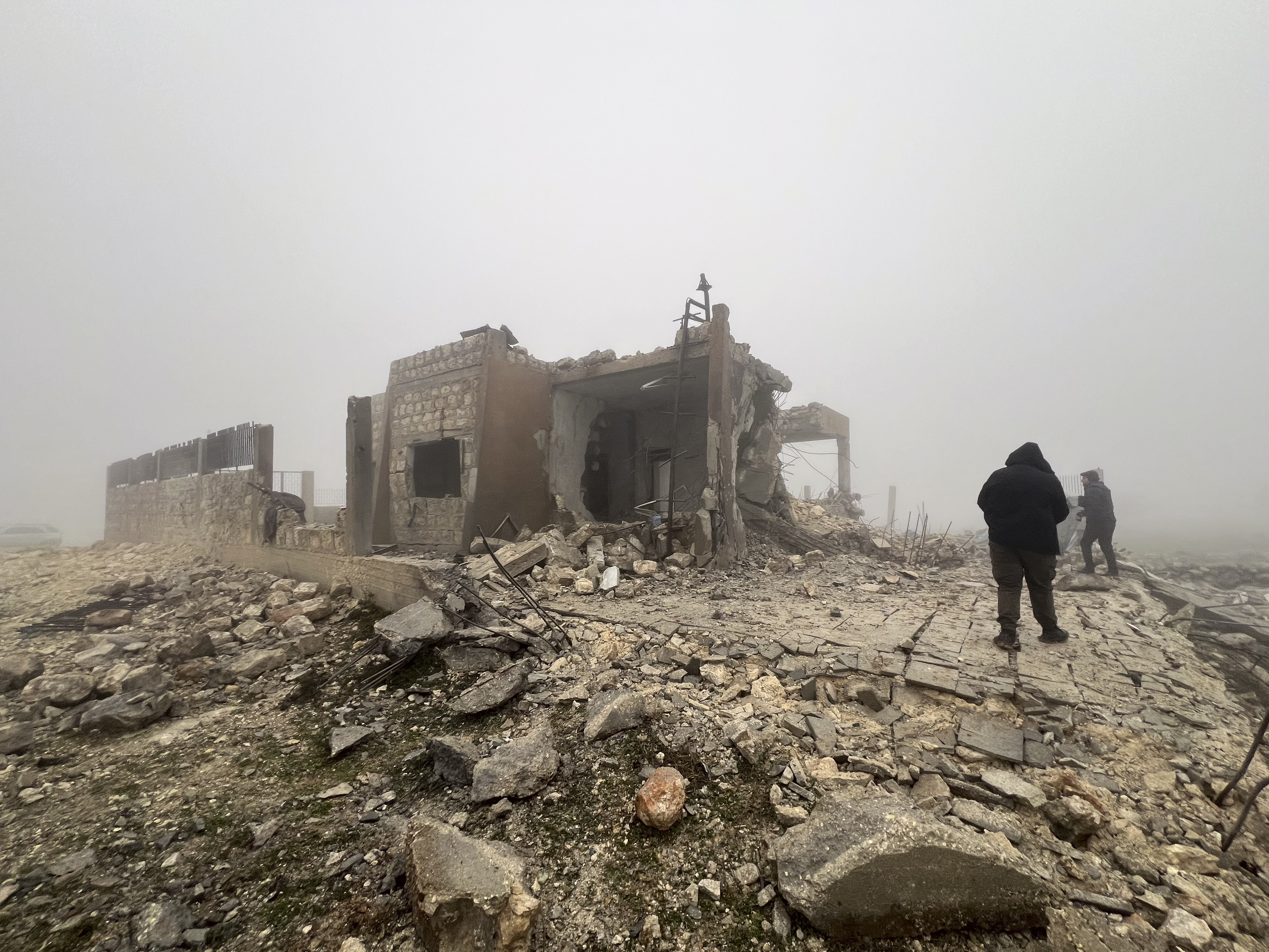 Syrians look at an abandoned medical facility in the village of Talteta, Syria on Tuesday, January 16, 2024, that was hit by Iranian missiles late on Monday night, according to a voluntary rescue group. Photo / AP